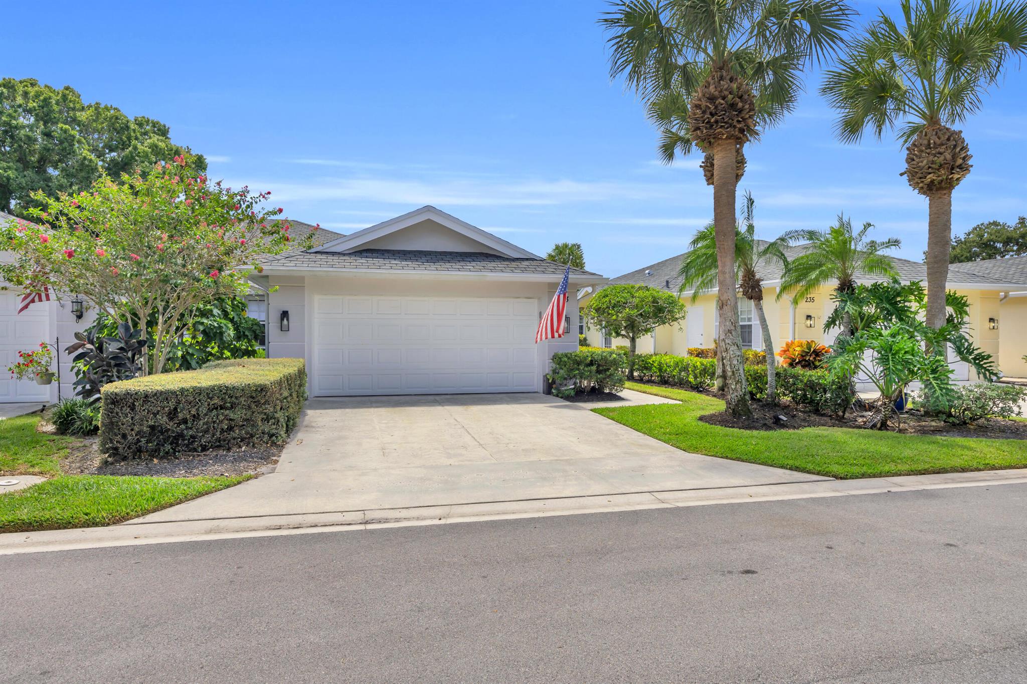 Welcome home to Divosta-built Villa to the very sought after ''Greenbrier'' on Golf Club of Jupiter (aka Indian Creek Golf Course). This 2- bedroom, 2- bathroom, 2- car garage Villa is situated on the 11th Green and boasts significant recent upgrades: 2023 AIR CONDITIONER, water heater, stove, microwave, dishwasher, refrigerator, garbage disposal, new faucets in kitchen and bathrooms, new flooring and window shades. NO polybutylene pipes! Come home and relax on the oversized screened patio!