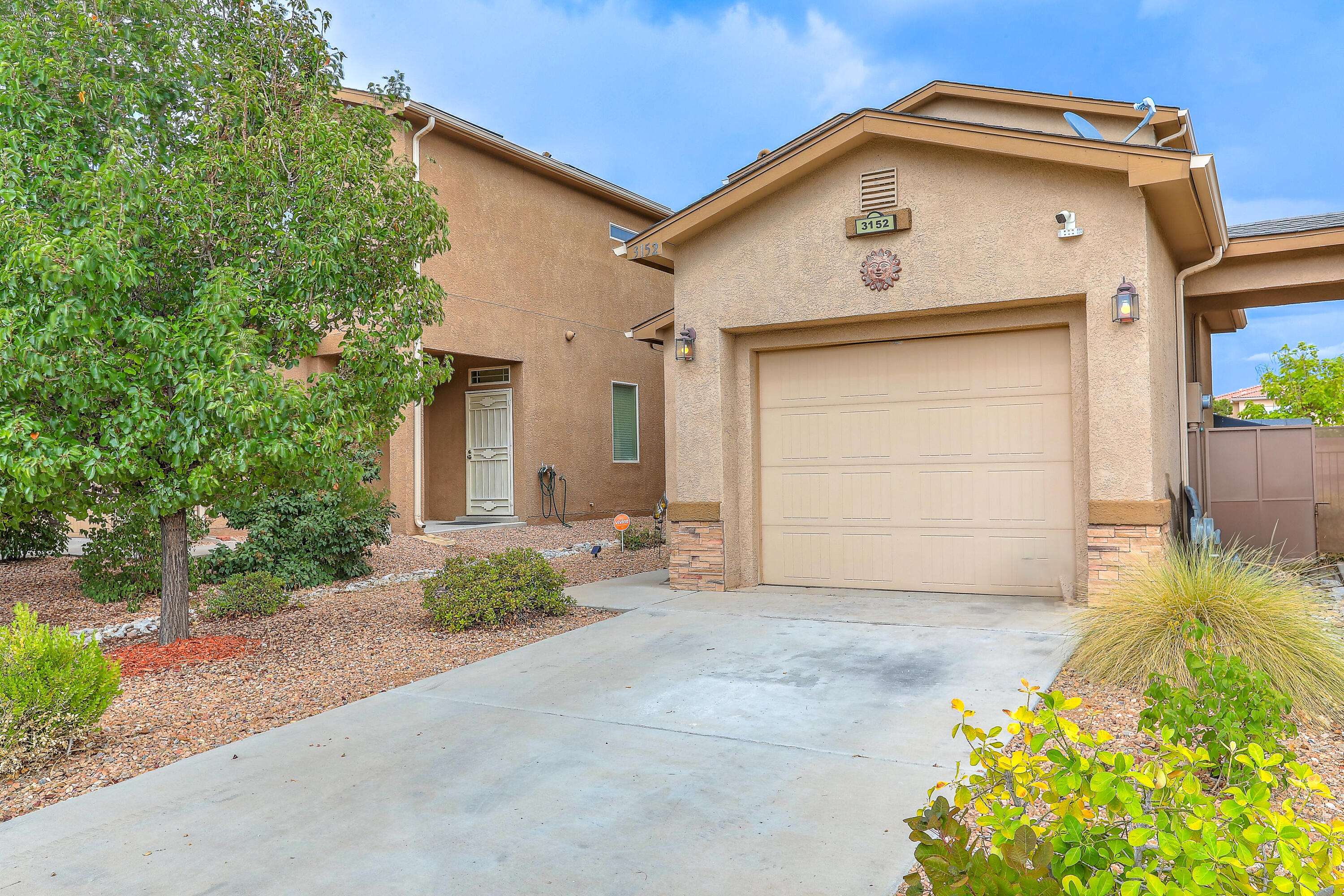 This two-story home lives larger than its square footage, designed with no wasted space. Featuring two primary suites, each with its own ensuite bath, this layout is perfect for multi-generational living or hosting guests in comfort. Soaring ceilings create an open, airy feel, while the kitchen offers a convenient pantry and flows seamlessly into the living areas. The laundry is conveniently located upstairs, making everyday living easy. Ceiling fans are thoughtfully placed throughout for added comfort. Step outside to a spacious backyard with a covered patio, ready for your personal touch--garden, play space, or outdoor entertaining. A smart floor plan, tall ceilings, and flexible living options make this home a standout.