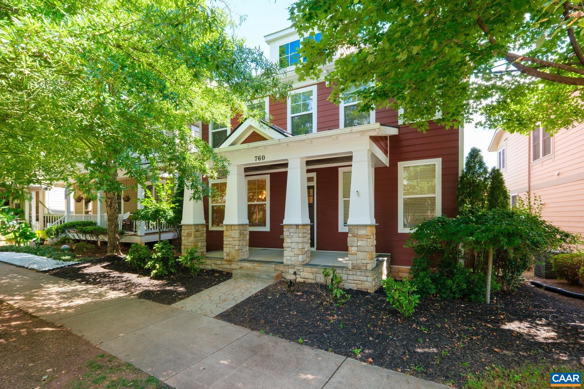 Stunning 4BR/3.5BA Craftsman blends luxury, comfort, and function in a highly sought-after location with multigenerational appeal. Enjoy relaxing mornings on the covered porch or entertain guests on the private rear patio with a stone fireplace. Inside, discover high-end finishes including hardwood floors, custom trim, and a two-sided fireplace connecting the spacious living room and light-filled sunroom; convertible to a screened porch. The chef’s kitchen is a dream with granite counters, premium stainless appliances, gas range, and furniture-grade cabinetry. Main level features 9’ ceilings, formal dining, breakfast nook, and a private office. The owner’s suite offers a serene retreat with an adjoining sitting room, large walk-in closets, and a newly remodeled spa-like bath with tiled shower and free standing tub. Downstairs, the finished terrace level includes a full kitchen, bedroom, bath, family room, and fitness space; ideal for in-laws or rental. Energy-efficient design with tankless water heater. Detached garage, extensive tile work, and access to community trails complete the package! The Belvedere is filled with sidewalks and parks to enjoy. The HOA includes Ting Fiber Internet!