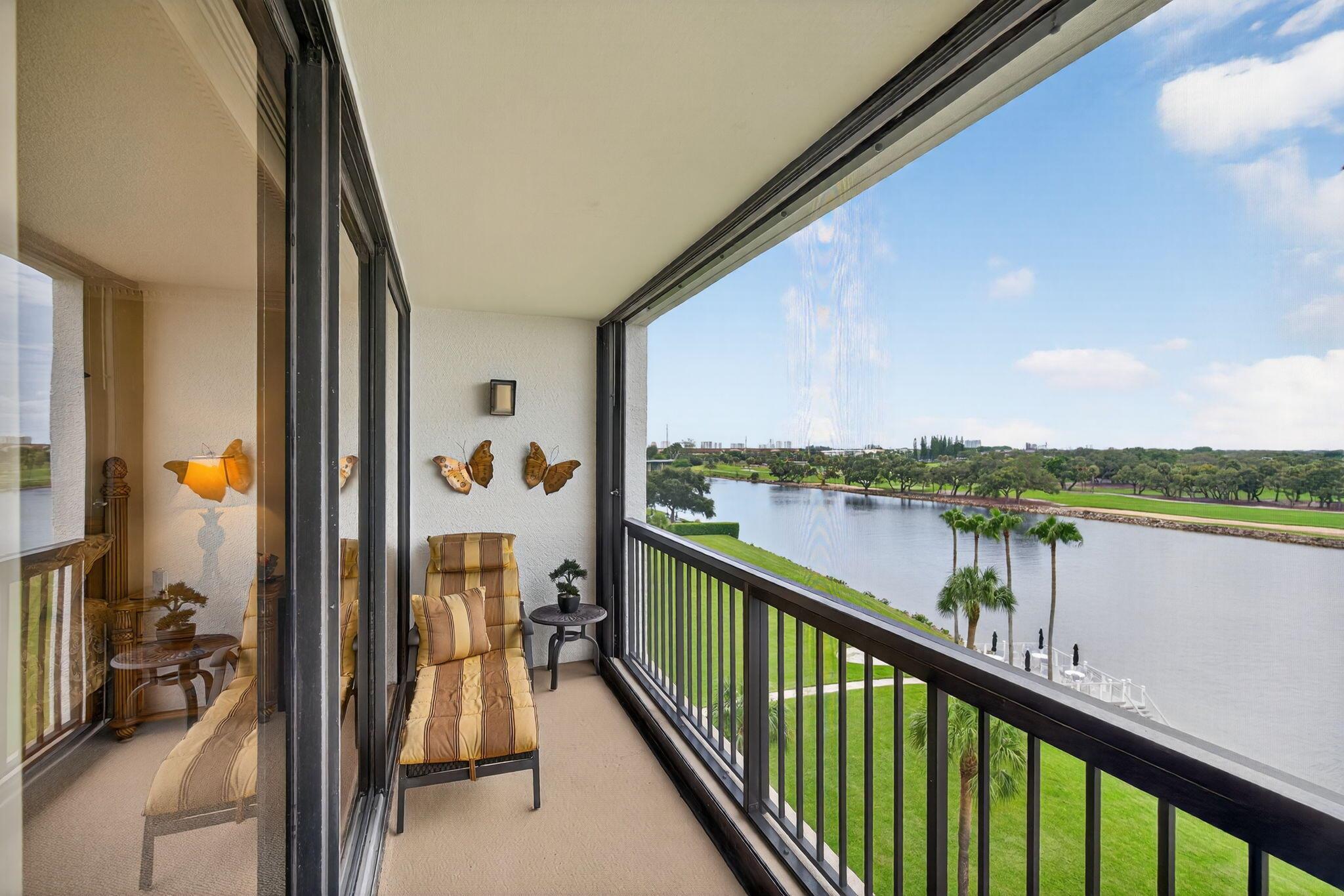 Step into this beautifully designed residence and enjoy breathtaking, unobstructed views of the Intracoastal Waterway, stretching East to Singer Island and the Atlantic Ocean. From sunrise to sunset, you'll love watching boats glide by and golfers tee off, all from your expansive private patio with floor-to-ceiling sliding glass doors that seamlessly blend indoor and outdoor living. Inside, the condo has been thoughtfully designed for both style and comfort, offering an inviting layout that's perfect for relaxing or entertaining. Governors Pointe is a gated community & offers resort-style amenities, including a newly renovated waterfront deck with firepit, BBQ area, and heated saltwater pool. Residents also enjoy a fitness room, library, community room w/ full kitchen & covered parking.