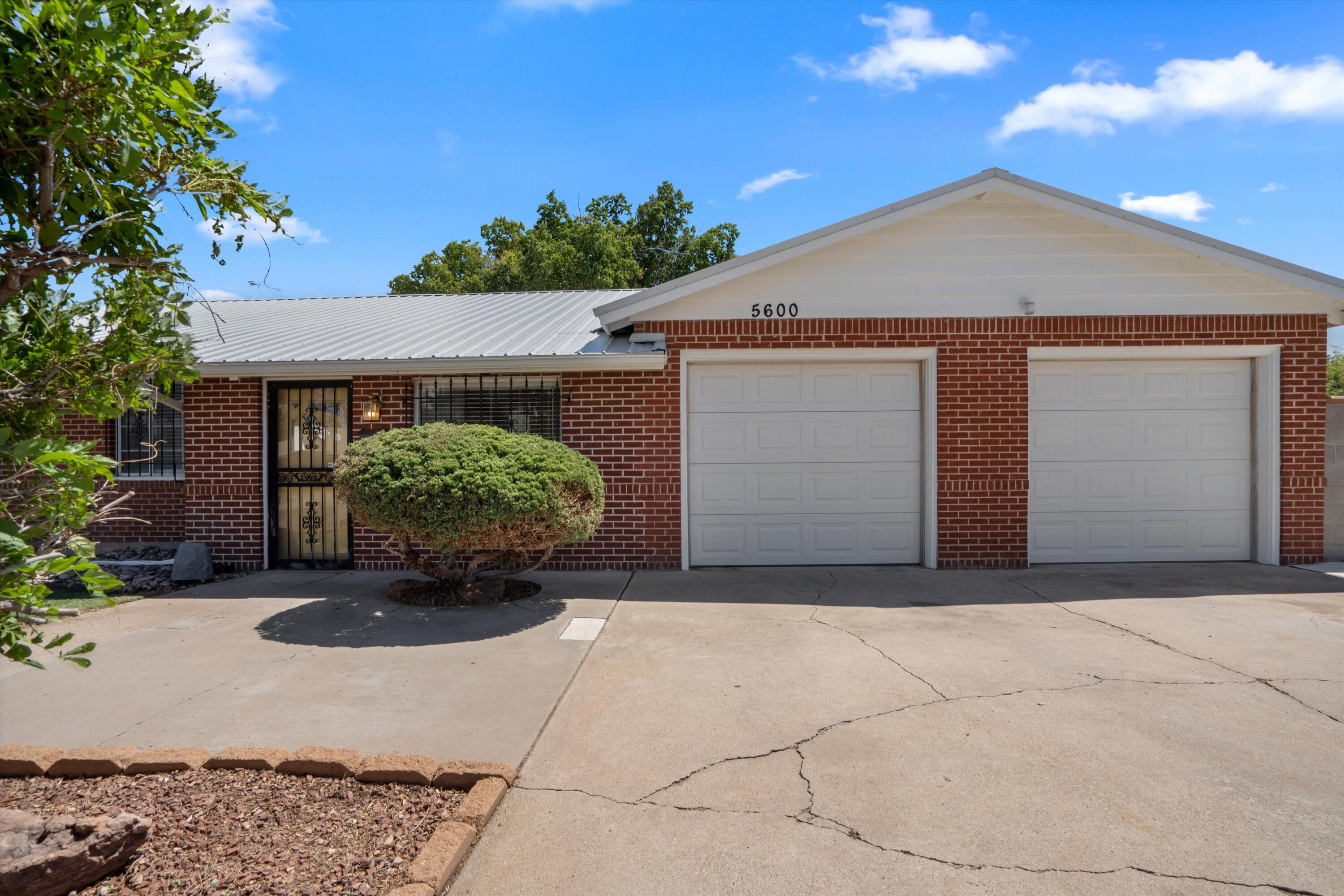Welcome home to this inviting 3-bedroom, 2-bath charmer with thoughtful updates throughout! Enjoy peace of mind with a brand-new metal roof, tile flooring, and water heater (all 2025). The spacious living room offers a cozy gas fireplace, while the kitchen comes equipped with all major appliances and plenty of storage. The primary suite is conveniently on the main level with a Jack & Jill bath, plus a full hall bath for guests. Relax in the fenced backyard with lush grass, gravel accents, and a storage shed that conveys. An attached 2-car garage with opener, move-in ready!