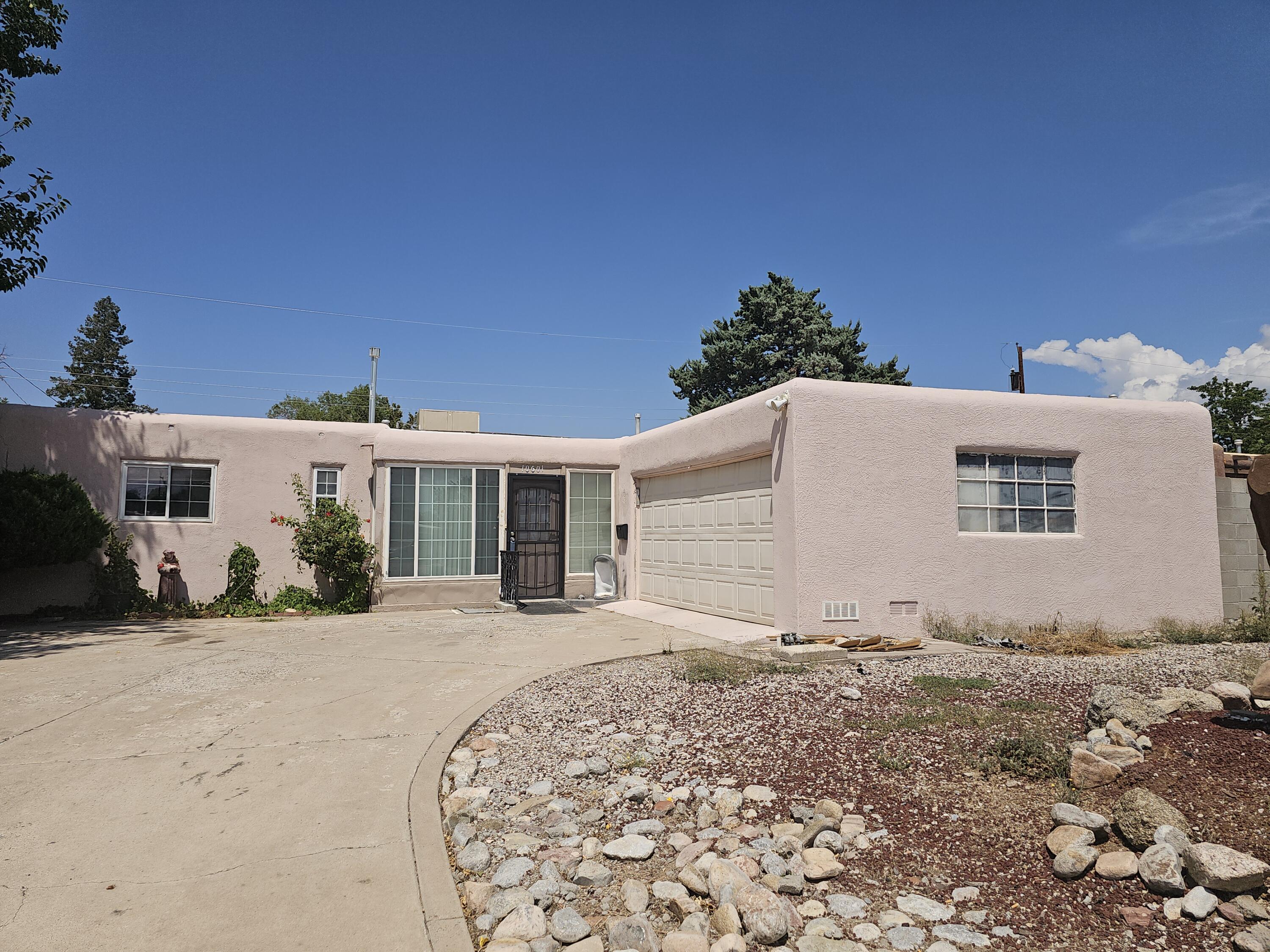 Investors Wanted. This home presents a charming southwestern character and enjoys a wonderful location. It features spacious living areas, a kiva fireplace, and generously sized bedrooms. The primary bath is quite large, including a substantial walk-in closet. A covered back patio and a sizable driveway, ideal for RV parking, are also included. This home is conveniently situated near schools, shopping, and dining options. Home sold as is.