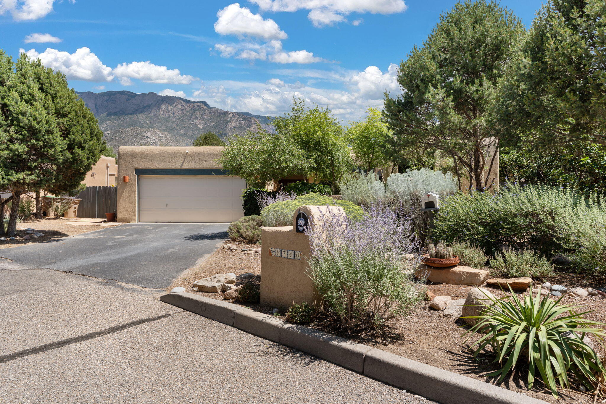 Sandia Heights Gem with Stunning Mountain Views!Experience the beauty of the Sandias every day in this inviting three-bedroom, two-bath home nestled in the highly sought-after Sandia Heights community. With breathtaking mountain views and a serene backyard retreat, this property offers the perfect balance of comfort and elegance.Step inside to a bright, open floor plan featuring an exceptional kitchen--ideal for cooking and entertaining--enhanced by skylights, custom niches, and thoughtful architectural details. The spacious living areas flow seamlessly, creating an airy and welcoming feel.The primary suite is a true haven, complete with direct access to a private courtyard where a peaceful water fountain sets the tone for relaxation. The backyard is equally impressive, offering both