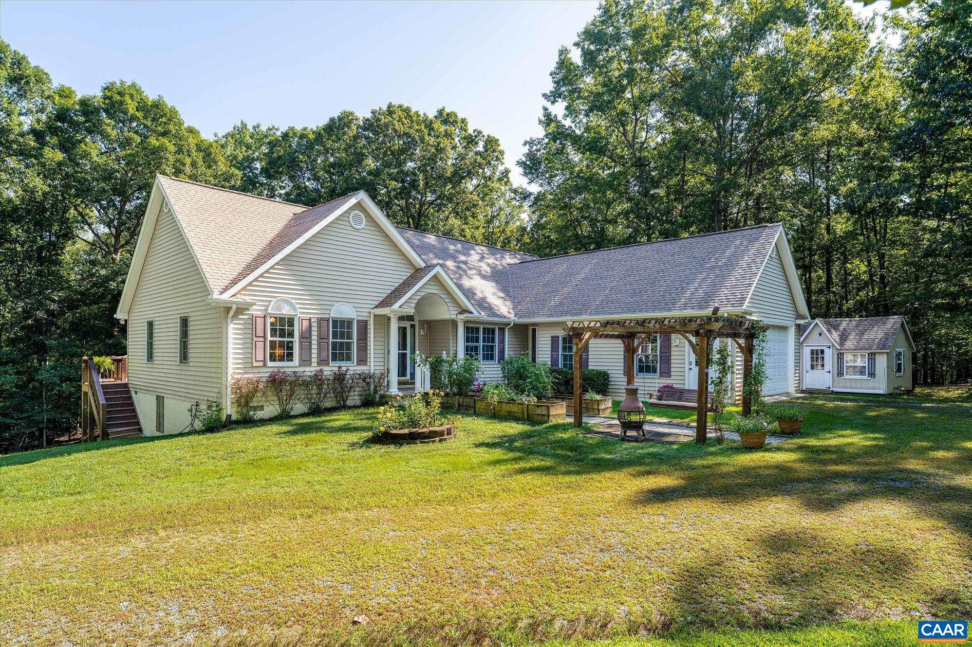 Just Listed-  OPEN HOUSE SUNDAY   1-3  the 7th. Does your bucket list include a walk to  lake near your home  and across street from nature conservancy.   Who needs an office or studio separate from house for your escape? In addition  an immaculate open sunny home built with fine touches as hardwood floors, vaulted ceilings, dramatic fireplace, sunroom, large eating area and gourmet kitchen, king master suite w jacuzzi & shower  and it just flows.  A must see home outside with curb appeal, and inside with wow features of openness and high vaulted ceilings.  Location near downtown Scottsville on 2.19 acres to enjoy.