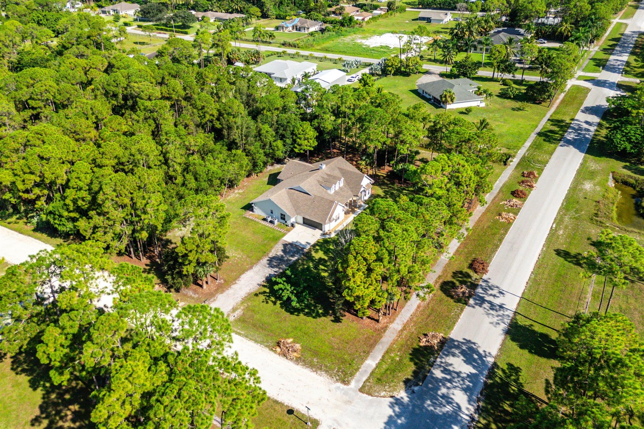 Welcome home to this spacious four bedroom, two bathroom residence with a two car garage, a full movie room, no HOA, and a generous 1.53 acre corner lot.Notable updates include new split A/C units with garage cooling (2024), a whole-home water softener and Oxygen Chamber (AIO) filtration system (2023), real hardwood flooring in the living room, RF remote-controlled blinds for the cathedral ceiling windows, and in-wall surround sound speaker/cable that runs in the movie room, office, and living room. The property is also equipped with smart home features controlling both thermostats, interior and exterior lighting, ceiling and bathroom fans, the Schlage front door lock, and the water heater.As you step inside, you are greeted by refined details and thoughtful upgrades. The entryway features beautifully laid tile flooring that flows into the open living area. A striking floor-to-ceiling brick fireplace serves as the centerpiece, complemented by soaring 15-foot vaulted cathedral ceilings that create a dramatic and inviting atmosphere.

The kitchen, dining, and living areas flow seamlessly together. The kitchen offers quartz countertops, solid wood shaker cabinetry, an oversized sink with new hardware, and a convenient pass-through window into the bonus room. The dining area is highlighted by an updated light fixture and tile flooring, perfect for gatherings. The living room ties the space together with brand-new solid wood flooring, modern lighting, and an open layout designed for both comfort and entertaining. A dedicated laundry room is located just off the kitchen for added convenience.

The master suite is spacious and inviting. It features wood-look laminate flooring, a tray ceiling with an updated light fixture, and dual closets including a walk-in. Large windows fill the room with natural light, creating a warm and relaxing retreat. The master bathroom is expansive, offering dual vanities with solid wood cabinetry, a large walk-around shower, a separate soaking tub, and a bidet.

The secondary bedrooms are generously sized. Each includes wood-look tile flooring, updated fixtures, ample closet space, and plenty of natural light. The secondary bathroom is beautifully designed with vertically laid wood-look tile flooring, a dual-sink vanity with solid wood cabinetry, and a fully tiled shower/tub combination with updated hardware.

A true highlight of this home is the private movie room, designed for the ultimate theater experience. It comes fully equipped with a 154" diagonal wall-mounted screen, UHD/4K/3D ceiling-mounted Epson LCD projector, Panasonic UHD/4K/3D-capable Blu-ray player, and a 7.2.2 Dolby Atmos DTS:X speaker system powered by a Denon AVR. Complete soundproofing enhances the space, making it the perfect spot for family nights, entertaining guests, or enjoying films in comfort.

Additionally, a large flex room at the back of the house features hardwood flooring and abundant natural light. This versatile space is ideal for a home gym, game room, or creative studio.

With no HOA and 1.53 acres of land, you have the freedom to bring your boat, RV, or create the outdoor retreat of your dreams. This property combines thoughtful upgrades, modern conveniences, and exceptional space, making it a rare opportunity that is ready for its next owner.