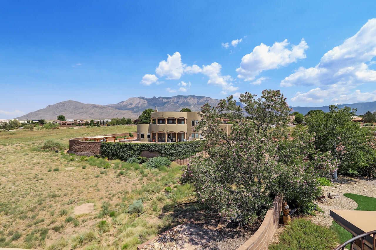 Stunning Custom Southwestern Masterpiece with Exceptional Quality and Views * Meticulously Cared for and Updated * Enter Through a Peaceful Courtyard with Water Feature *  TPO Roof * Pella Wood Windows * Radiant Heat * Exquisite Tile Work * Seller Owned Solar System Results in Under $15 Monthly Electric Bills * RV Garage * Unique North Albuquerque Acres Neighborhood with Underground Utilities and Community Water System * Floor Plan Designed to Take Advantage of Mountain and City Views * Primary + Office/Study on One End of Home and Additional Bedrooms on Other End * Beautiful Wood Posts, Vigas, and Beams * Custom Fireplaces * Wide Hallway with Barrel Ceiling * Skylights * Basketball Court * East Facing Back Yard with Rooftop Deck * New Septic Tank * Call Your Realtor for a Showing Today