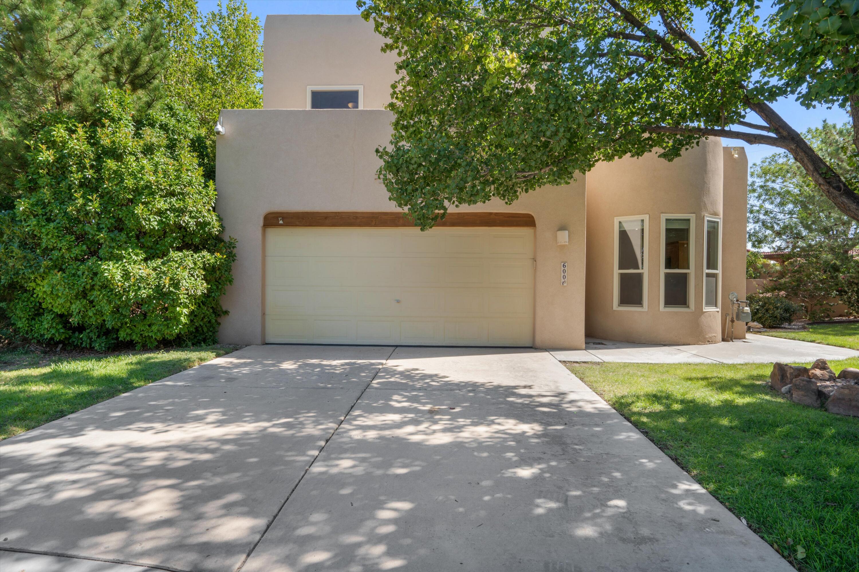 Hidden Valley is Albuquerque's best kept secret neighborhood! This beautiful 4 bedroom, 2 1/2 bath home is ready for you to call it yours! NEW ROOF (2025), Windows (2020), A/C, heating (2020). The primary bedroom is located on the main floor with the remaining 3 bedrooms upstairs. Stay cozy in the winter with 2 fireplaces and cool in the summer with REFRIGERATED air. Outside you will find a large, fully landscaped backyard with mature fruit trees. HOA takes care of the front landscape, pool, common grounds, clubhouse, water & trash. Schedule your showing today!