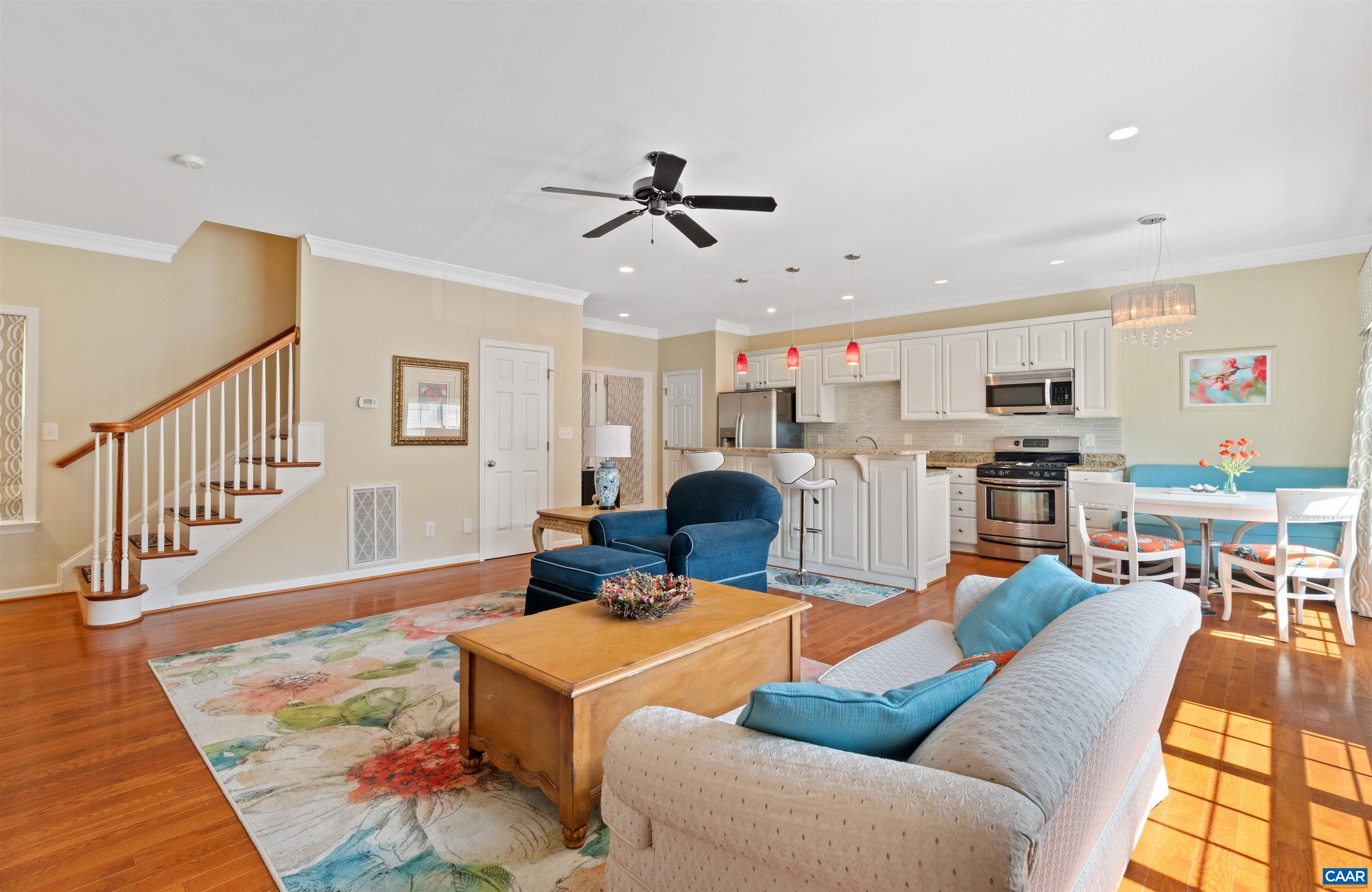 LUXURY TOWNHOME IN SOUGHT-AFTER BELMONT; JUST MINUTES FROM THE DOWNTOWN MALL IN CHARLOTTESVILLE! This updated 3BR/3BA home in Belmont Village offers open floor plan with living and dining room areas flooded with natural light from windows surrounded by custom drapery shining onto hardwood floors throughout. The main living room boasts 9-ft ceilings, crown moulding, a charming gas fireplace, and beautiful built-ins. The expansive eat-in kitchen features white maple cabinets with dove tail and soft close finishes, granite countertops, a large island, upgraded tile backsplash, pantry, and stainless-steel appliances. The HVAC is a dual-zone heating/cooling system updated with new Trane heat pump in 2020. The primary bedroom offers an en-suite bathroom with a double vanity, as well as two closets, including a spacious walk-in closet. The townhome features a central vac, a private rear deck, in addition to an oversized two-car garage with plenty of storage. Laundry is located on the top level with new 2023 GE washing machine. Belmont Village is located near Belmont and Quarry Parks, across from walking trails near the Rivanna River, less than 2 miles to UVA, Downtown Charlottesville and 5th Street Station Shopping Center.