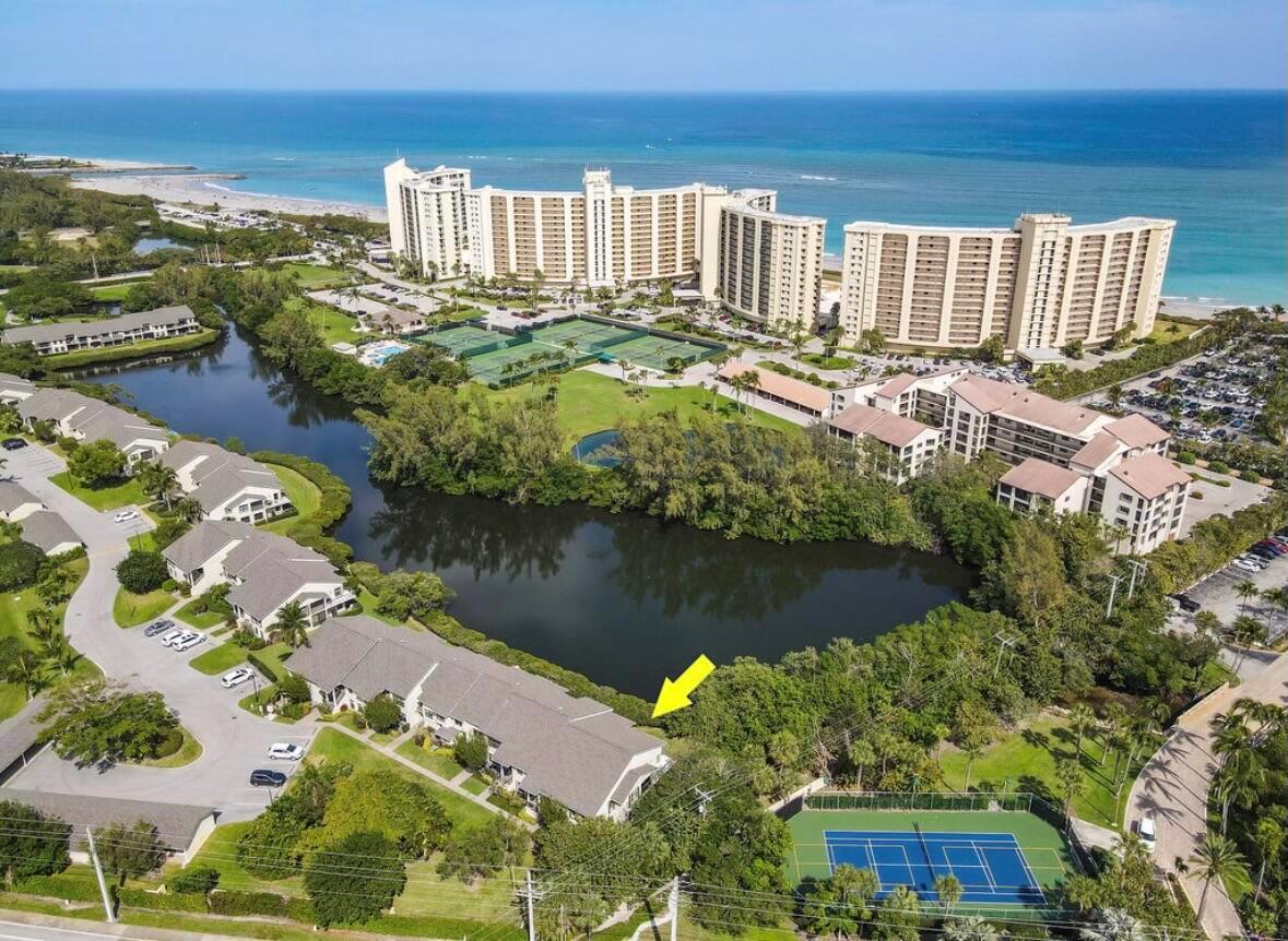 Available for 2026 season $7,500/mo January 1, 2026-April 30, 2026 in Jupiter Dunes. Presenting an exquisite first-floor end unit at Jupiter Dunes, fully renovated to meet modern standards and aesthetics. This home features a wide-open and spacious floor plan, highlighted by a wrap-around patio that offers stunning water views, allowing you to immerse yourself in the true beach lifestyle. Just a short walk away, you can enjoy the sandy shores of the beach and the scenic Inlet Park, perfect for outdoor adventures and relaxation.The property boasts an expansive private patio, providing ample space for entertaining guests or enjoying peaceful moments in the sun. Inside, the large living area is designed with a thoughtful 2-bedroom, 2-bathroom split floor plan, ensuring both comfort and privacy. Additionally, a screened-in covered patio extends from the kitchenette and dining area, creating an inviting space for meals and gatherings while enjoying the gentle ocean breeze.

Convenience is paramount, with an in-unit washer and dryer for effortless laundry days. The community enhances your lifestyle with a welcoming clubhouse, 2 refreshing pools, and a host of other amenities to enjoy.

Located in close proximity to the Maltz Theatre, Dubois Park, a variety of restaurants, and much more, this unit offers not just a home, but a vibrant lifestyle filled with entertainment and leisure. Experience the perfect blend of luxury, comfort, and beachside living in this remarkable property.