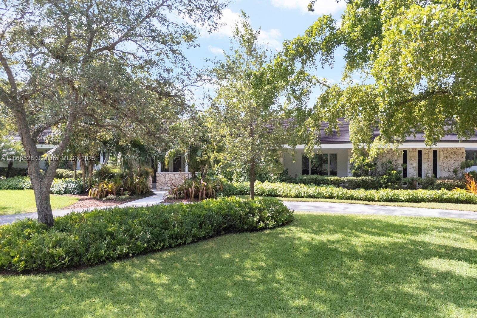 Gorgeous Pine Bay Estates North sophistication and style galore- fantastic Hollub-built family home with soaring high ceilings and windows, an incredible state-of-the-art kitchen (w/tons of storage!), and nice open layout.  Modern finishes with full house renovation completed in 2017-2018 including roof, impact glass windows and doors, plumbing, electrical, and more!.  Huge open-air patio overhang ideal for entertaining that leads to a spacious and private pool yard area.  Lush landscaping, built-in breakfast nook, and gorgeous views from every room.  Quiet street in coveted Coral Gables subdivision (with 33156 zip code and Pinecrest schools) and NOT in a flood zone.
