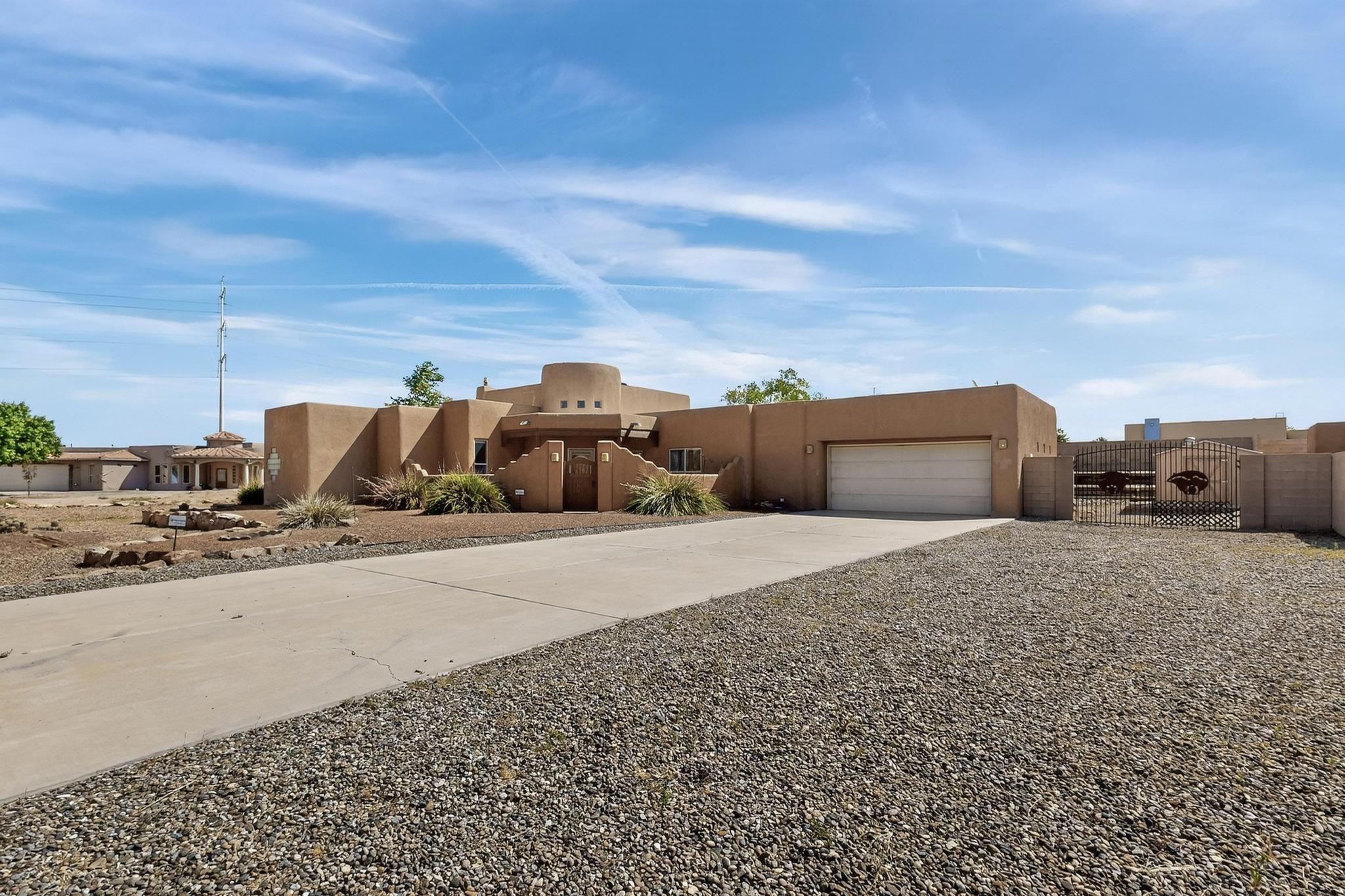 Welcome to this beautiful South Valley retreat on large lot, NO HOA! This home offers the perfect blend of comfort and functional living. Featuring 3 spacious bedrooms and 2 full baths, 2 car garage with side yard access for all your toys.  The home boasts an open-concept floor plan with plenty of natural light throughout with southwest style. Vigas in living area flows seamlessly into a modern kitchen equipped with updated appliances, ample cabinet space, and a breakfast bar, perfect for casual dining. The primary suite offers a private retreat with a generous closet and en-suite bath. Step outside to a low-maintenance backyard, ideal for relaxing or entertaining. Conveniently located near schools, shopping, freeways, close to Kirtland AirForce Base, major hospitals and great dining.