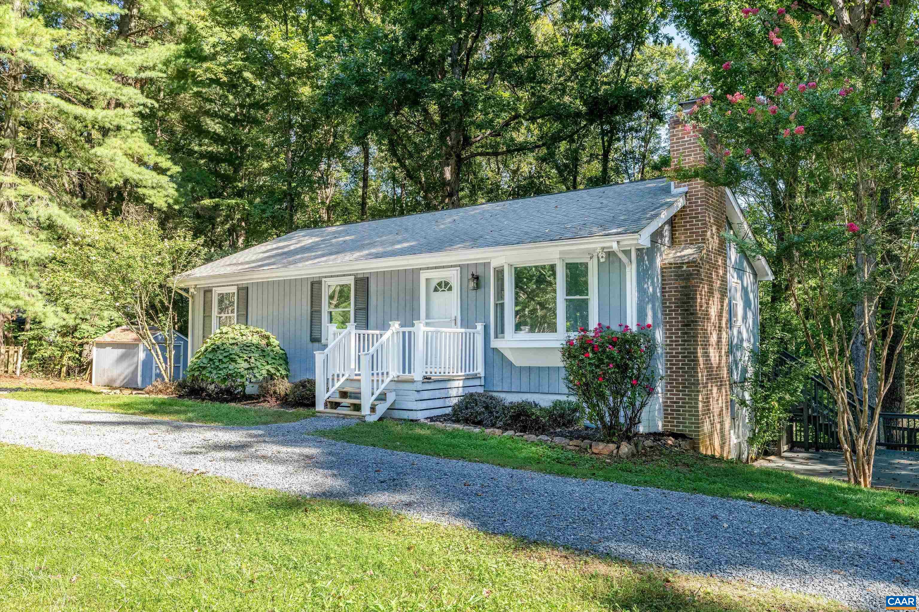 CHARMING RANCHER ON 3 PRIVATE ACRES IN STONY POINT MINUTES FROM RT 29, CHO AIRPORT, SHOPPING, GROCERIES, RESTAURANTS, TARGET, & MORE. Property features a expansive deck overlooking the private lot with a lower deck patio perfect for entertaining. Enjoy peace, quiet and privacy while being 15 minutes from all the conveniences Charlottesville has to offer. This 4 bedroom, 2.5 bath home offers almost 2,200 finished square feet of living space, including a fully finished walk-out basement. The main level features a spacious family room with a brick wood-burning fireplace, a bright kitchen, three bedrooms including a primary suite with attached bath, and convenient main-level laundry hookups. The finished basement adds a second family room with another wood-burning fireplace, a bedroom/office, full bath, bonus room and laundry area. Outdoor living is a highlight with a rear porch, deck, and patio overlooking the private, partially fenced, wooded lot. Additional features include garden space and plenty of room for entertaining or play. Set on 3 acres in the Stony Point area, this home combines privacy with convenience in a desirable location.
