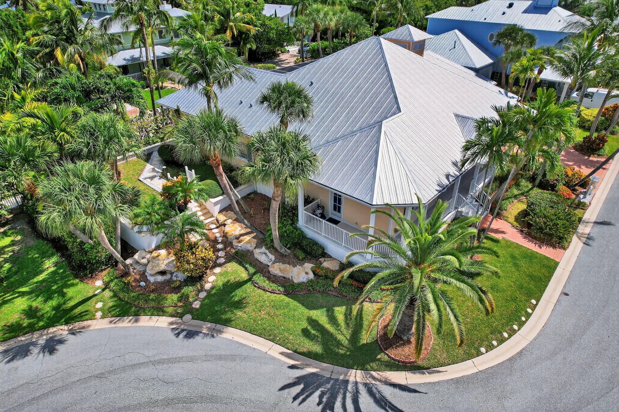 Discover coastal living at its finest in this custom one-story Key West-style home, located at the end of a private cul-de-sac in Juno Beach's exclusive Seaside community. Elevated nearly 12 feet above sea level, this beautifully maintained residence offers over 3,000 sq ft of living space with high ceilings, an open floor plan, and luxury finishes including crown molding, plantation shutters, and French doors. Enjoy a formal dining room with butler's area, a dedicated home office with built-ins, and a charming wrap-around porch perfect for catching ocean breezes. Each bedroom offers access to the exterior grounds and pool areas, blending indoor comfort with outdoor living. Murphy beds in 2 rooms provide seamless convertible bedroom options, ideal for guests or flexible use of space. Step outside to your screened-in pool area&#x14;with fountain and outdoor shower to an inviting tropical oasis with views of the scenic Juno Dunes Natural Area. Enjoy peace of mind with a new metal roof (2022), full hurricane protection (Anderson thermal pane windows and doors with dual locks), 3 car garage with utility area and three phase electric for EV charging, alarm system. Recent updates include new HVAC systems (2024), hurricane rated pool enclosure (2022), and gutters (2022). Ample attic space was constructed for storage, with foam insulation throughout for year-round energy efficiency and comfort.  Ideally situated between the Juno Preserve and the Atlantic Ocean, this property embraces a relaxed coastal lifestyle. With Pelican Lake and beach access just a short stroll away, and close proximity to top amenities like the Gardens Mall, Juno Beach Pier, and Palm Beach International Airport, this home offers the perfect blend of privacy, comfort, and location.