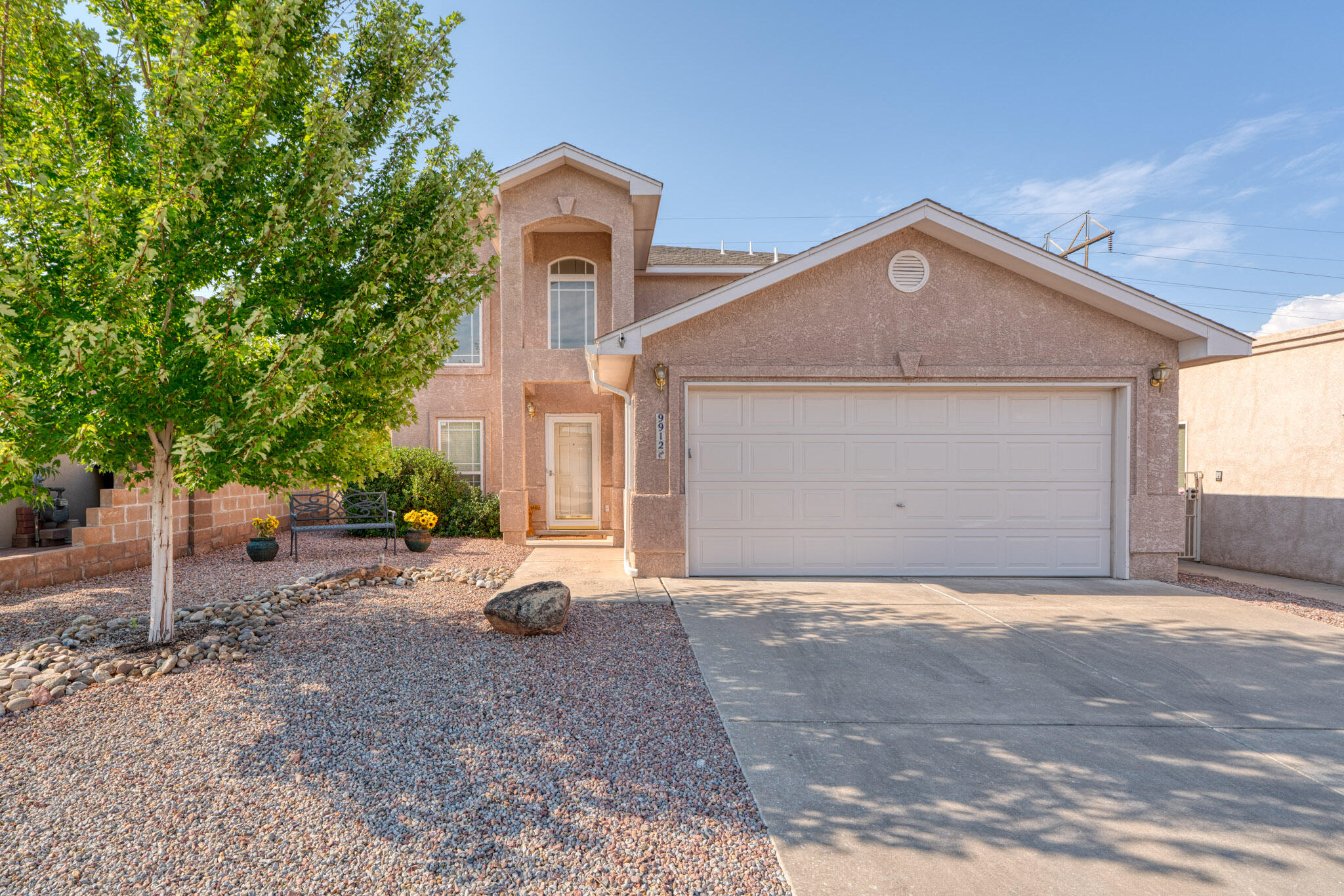 Stunning two-story home tucked in the desirable Quintessence neighborhood, close to parks, trails, and top-rated schools. Convenient main level private primary suite, AC, & fresh flooring throughout - including beautiful kitchen tile, updated carpet, and stylish wood-look tile. The kitchen features granite countertops & stainless steel appliances, while a cozy gas log fireplace and cathedral ceilings create a warm and inviting living space. A whole-home humidifier has also been added to the HVAC system for extra comfort. Upstairs, enjoy breathtaking views of the Sandias at sunset or the Tanoan golf course from your private balcony. Two loft spaces provide flexibility for play or work- one could even be converted to a 4th bedroom. Beautifully landscaped backyard, covered patio and hot tub!