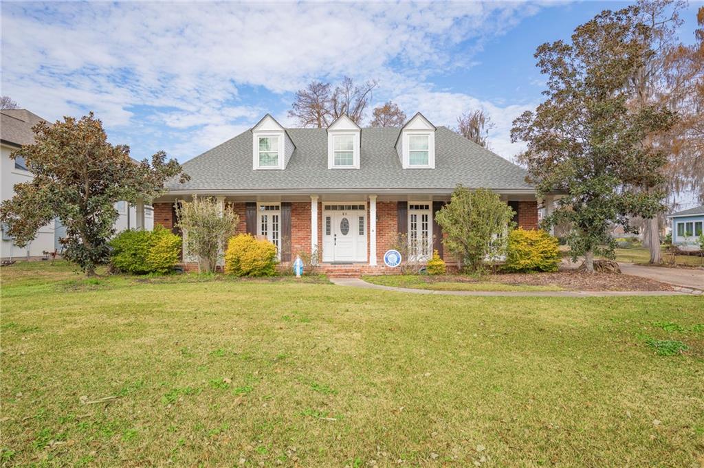 Discover your dream home in this stunning 4-bedroom Acadian, perfectly positioned on the picturesque 12th fairway of Cypress Lakes Country Club golf course! This lovely home boasts an exceptional floor plan that welcomes you with a foyer featuring soaring ceilings, a formal living room (currently used as a playroom) with French doors, separate dining area, providing the ideal setting for entertaining guests and creating cherished memories.

The cozy den, complete with a charming fireplace, invites relaxation and warmth, while the breakfast area and primary suite offer breathtaking views of the golf course, making every morning feel like a retreat. Step outside to your brick screened-in patio, where you can enjoy al fresco dining or unwind with a good book in a serene setting. 

But that's not all! This home features a delightful bonus: a sunroom on the second floor that showcases stunning vistas, walk in attic space.  With a spacious two-car attached garage and a generous driveway that accommodates six vehicles, convenience is at your fingertips.

Don't miss this opportunity to own a timeless beauty that truly has it all—comfort and breathtaking views await you in this remarkable home ready for you to make your own.