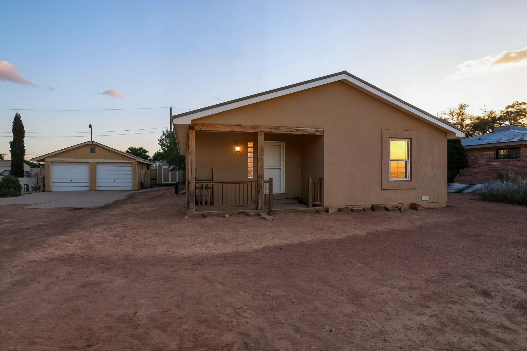 Wonderful home located on a gated .29 acre property in the heart of the South Valley. Home features 1,261sf with 2 bedrooms, a full bath and a detached 2 car garage! Spacious living area with upgraded laminate wood floors. Kitchen with oak cabinetry, ample countertop space, stainless steel gas range, microwave, dishwasher and a pantry. Two guest bedrooms with upgraded flooring. Large bathroom with a soaker tub and walk-in shower. Great backyard with two storage sheds and a covered patio!