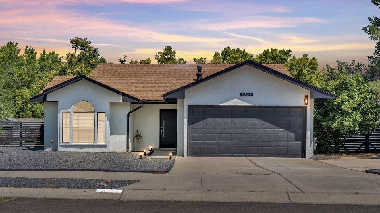 Beautifully updated 3 bed, 2 bath home in NW Albuquerque! Home features stainless steel appliances including a freezer, washer, and dryer and refrigerator. Enjoy the additional 200 sq ft sunroom for year-round relaxation. Situated on a spacious 0.20-acre lot with side yard access and low-maintenance artificial turf landscaping. Modern finishes throughout with a stylish kitchen and beautifully remodeled bathrooms. Turnkey and move-in ready with a brand new master-cool unit!