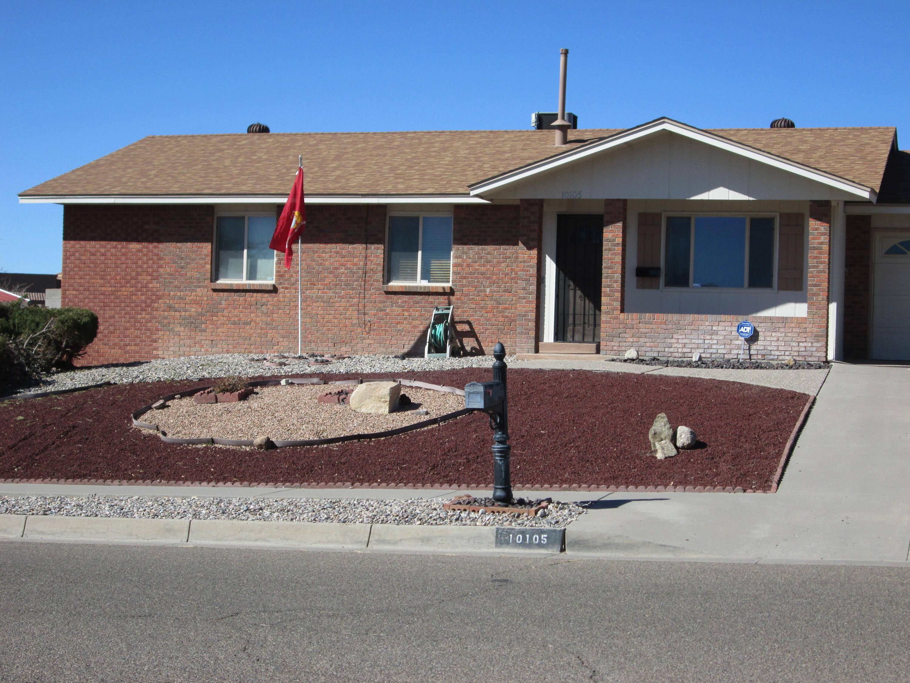 This well-maintained Far Northeast Heights home is on a large corner lot with great mountain views. The front has easy-to-maintain Southwestern landscaping. This property has two living areas; one has a wood-burning stove-both have wood laminate flooring. The primary bedroom has new carpeting, a full bath with a shower, and a jetted tub. The second bedroom also has new carpeting and the third has tile. The large kitchen has plenty of cabinet and counter space with a built-in grill, stainless steel appliances, and a island, custom wood blinds on most windows. The 2-car garage has a workbench and room for storage. The home also has a newer roof, a fruit tree, and refrigerated air.The seller prefers not to make repairs, and inspections are for the buyer's info.