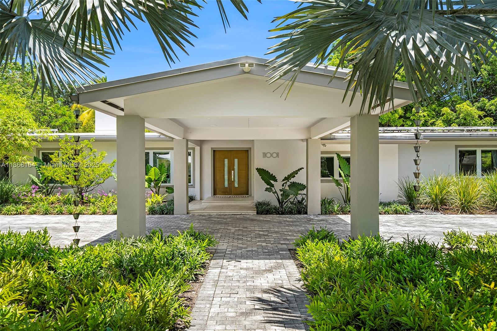 Positioned on a 34,000 square foot corner lot in North Pinecrest, 11001 SW 64th Ave is a one-story, 4,600 sq. ft. single-family residence currently configured with 4 bedrooms and 4 bathrooms, with the option to make it a 5-bedroom. The home features ceilings up to 10.5 feet, impact windows and doors throughout, a heated swimming pool, and it is fully gated with a covered driveway. Defining features include a recently renovated kitchen with top of the line appliances, two distinct dining areas, a massive great room and family room separated by a brick detail fireplace, renovated bathrooms, tons of natural light, a massive playroom, dedicated laundry room, two car garage and a turnkey backyard with a heated pool, covered patio with a summer kitchen + dining area and tons of outdoor space.