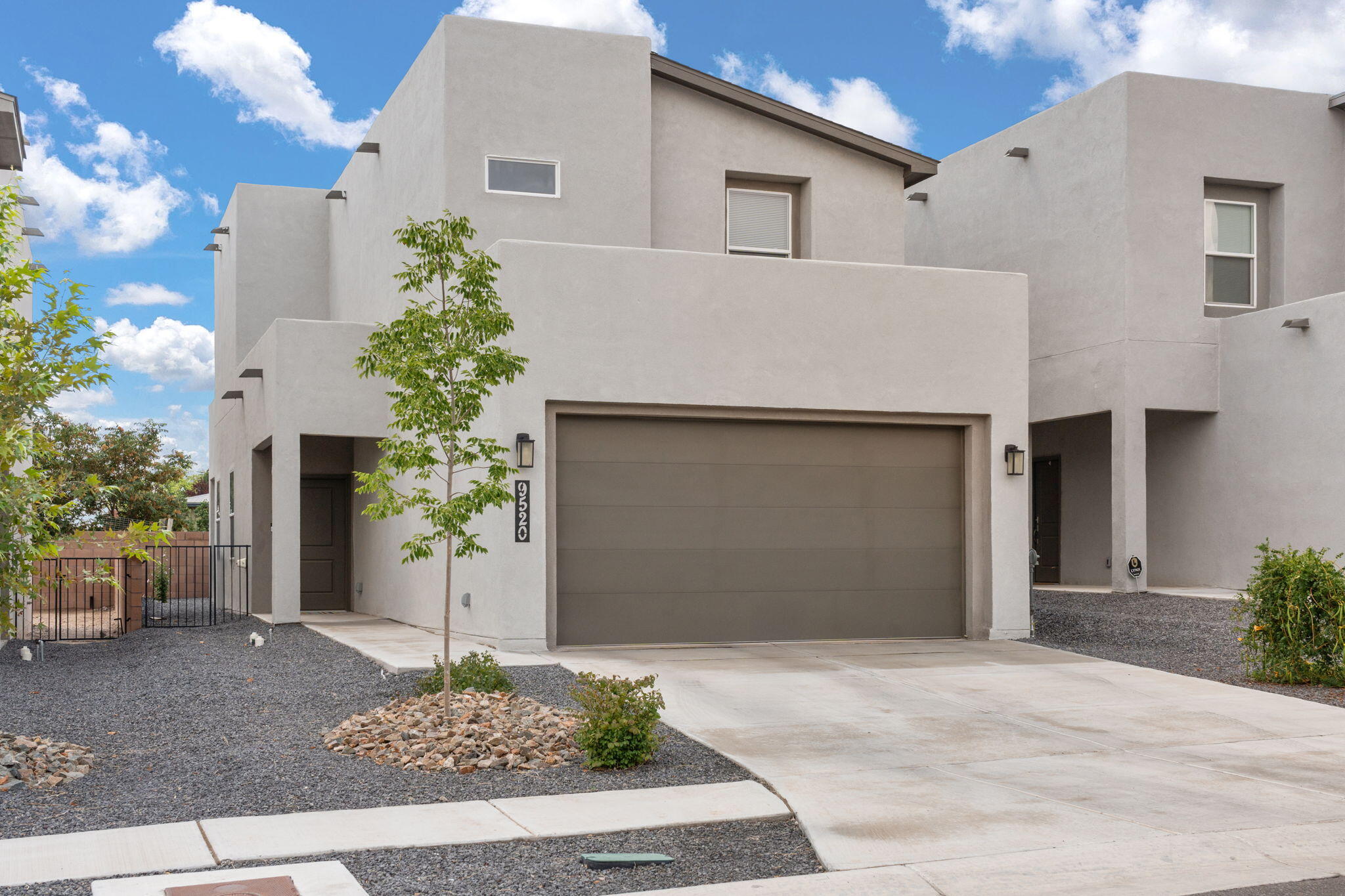 Built in 2023, this home offers modern style, thoughtful upgrades, and great value compared to others nearby. The open layout connects the kitchen, dining, and living areas, creating a bright, welcoming space. The kitchen features stainless steel appliances and a large island, ideal for cooking and gathering. Upstairs, the owner's suite includes a walk-in closet and spa-like bath with double sinks and walk-in shower. A second large bedroom with nearby full bath adds flexibility for family, guests, or office. Expansive windows throughout bring in abundant natural light. Conveniently located just 15-20 minutes from Sunport International Airport, Downtown Albuquerque, and Kirtland Air Force Base. This home combines location, upgrades, and price for one of the best values in the neighborhood.