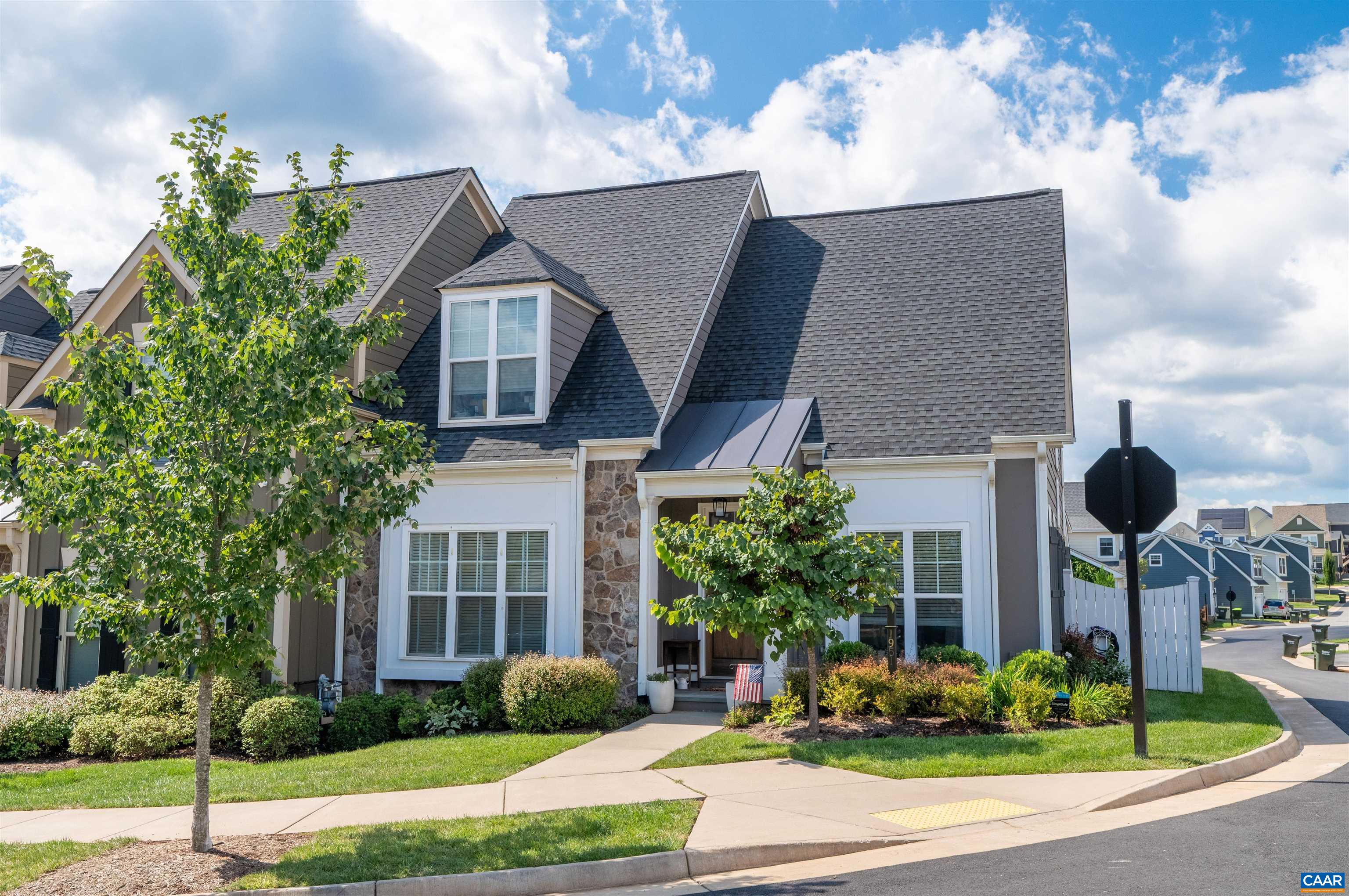Located in the highly sought-after Belvedere neighborhood, this 4-bedroom, 3.5-bath end-unit home offers main-level living with an open-concept design. Built by Craig Builders, a respected local semi-custom builder known for exceptional craftsmanship, the home features elegant hardwood floors that flow seamlessly throughout the main level. The upgraded gourmet kitchen is equipped with granite countertops, stainless steel appliances, and ample space for entertaining. Year-round comfort is ensured with three-zone heating and cooling, a tankless hot water heater, and an external generator rough-in. The first-floor primary suite includes tray ceilings, a spacious walk-in closet, and an ensuite bath with dual vanities and a waterfall shower head. Additional features include first-floor laundry, a home office, 3 upstairs bedrooms, a loft area, CAT 6 wiring for high-speed internet, and a beautifully landscaped, fenced-in yard with a spacious patio. Ample storage and parking, with a two-car garage and a driveway offering space for additional vehicles. The HOA covers Ting Fiber Internet and lawn care. Experience the advantages of a newer home without the delays and higher costs of new construction. Open House this Sunday, 5th, from 1-3pm!