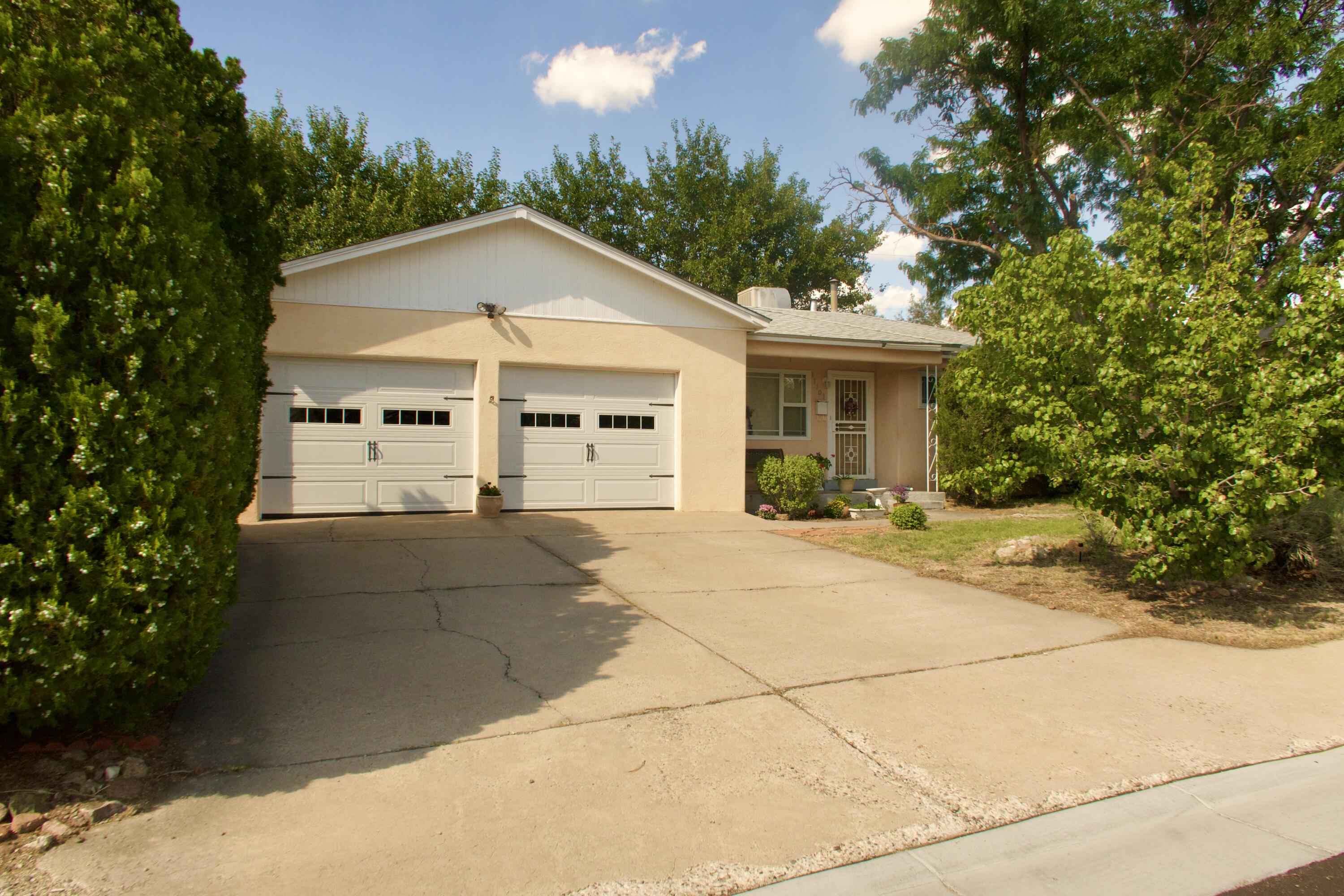This 3 bedroom, 2 bath home has been lovingly owned by the same family since 1994 and very lightly lived in never rented, only used for family and visiting guests. Inside you'll find a beautiful wood-burning fireplace, spacious living areas, charming coved ceilings, & extra flex space , office, or hobby area. The large side laundry room includes an exterior door for convenient backyard or side yard access. Updates include windows (2005), roof (2010), and new garage insulation. Move-in ready condition, and a cute front porch for relaxing, this home offers both character and comfort in a highly desirable location. Tons of natural light and a functional floor plan. Quiet street & great NE HEIGHTS LOCATION!