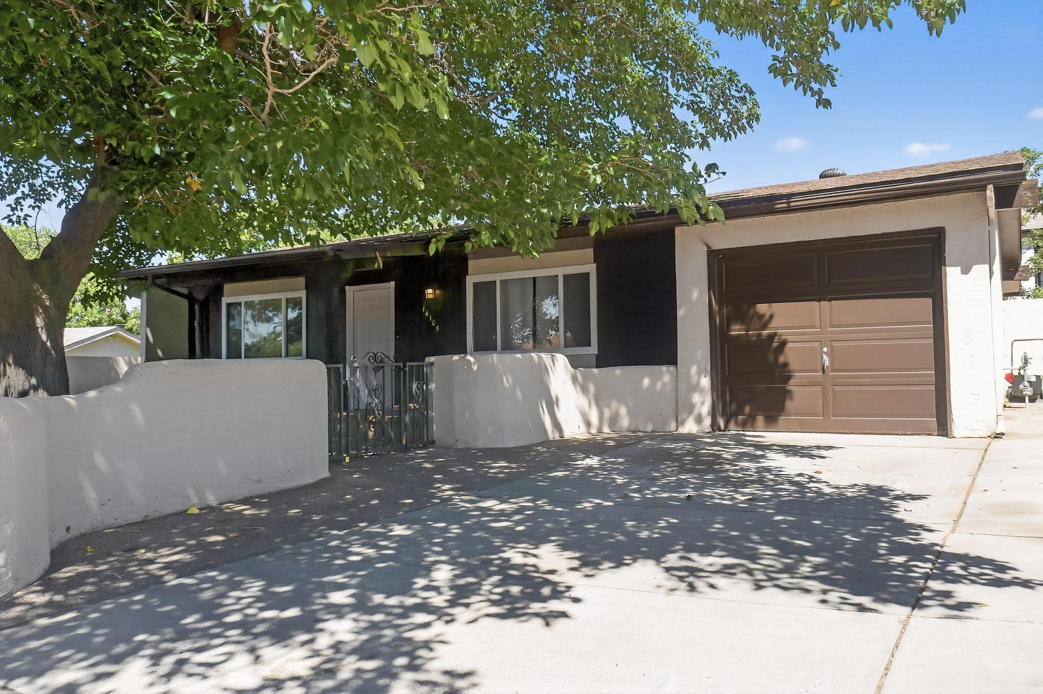 Fully renovated in 2019, this home has been thoughtfully updated with lasting quality and style. Modern upgrades include paint, flooring, kitchen cabinets, countertops, and a stainless steel appliance package. Featuring new electrical and plumbing fixtures, ceiling fans, an upgraded electrical panel, garage door opener, windows, and landscaping. Blending contemporary design with reliable improvements, this move-in ready home offers a large private yard and beautiful mountain views right out your front door. Located just west of Tramway, with easy access to shopping, dining, and UNM. Book your private showing today!