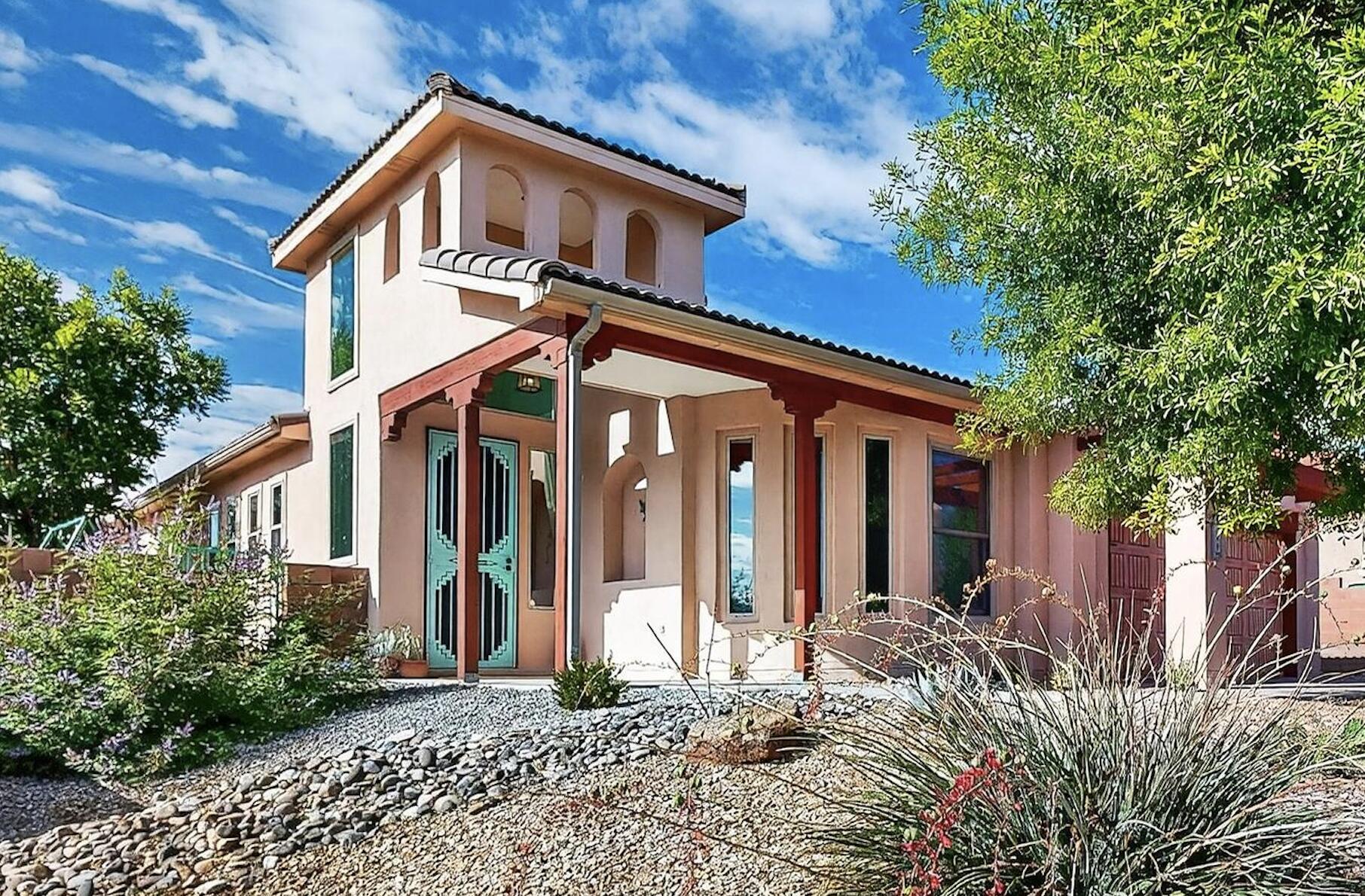 Discover your dream southwestern home with endless sunshine, open skies, and panoramic Sandia Mountain views! Located on a peaceful corner lot in Wallen Park, this single-level home features 3 bedrooms, 2 baths, a dedicated office, and a bright sunroom. Vaulted ceilings and an open kitchen with island create a welcoming space perfect for relaxing or entertaining. Newer windows, solar light tubes, and solar panels enhance energy efficiency. The oversized primary suite offers a spa-like retreat with a walk-in shower, double vanity, and large closet. Enjoy low-maintenance xeriscaping, mature shade trees, all-level accessibility, a 2-car garage, and a storage shed. A $5K seller concession allows interior customization. Your perfect southwestern retreat awaits!