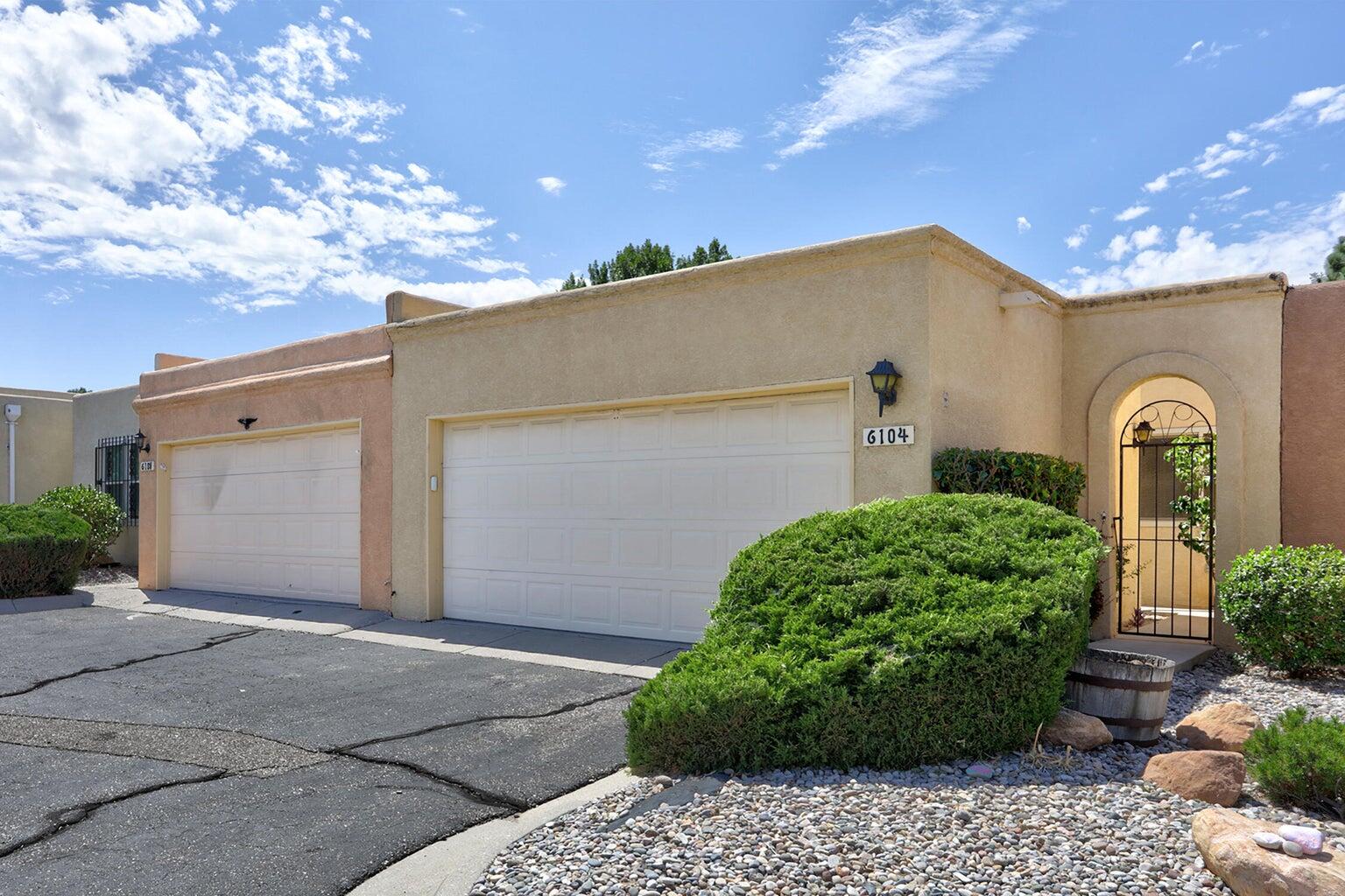 Welcome home to this charming 2-bedroom, 2-bath, 2-car garage townhouse in the desirable Chimney Ridge community! Nestled on a quiet private drive just off Osuna--and right across from the Arroyo del Oso Golf Course--you'll find comfort, convenience, and charm all in one place. Step inside to discover hotel-suite style bedrooms, an updated kitchen, and a light-filled layout that feels both stylish and cozy. Enjoy morning coffee on the back patio with blooming roses and surrounded by trees. This inner courtyard view is refreshing. The community itself also offers so much to love: a sparkling pool, tennis courts, and a welcoming clubhouse--perfect for unwinding or gathering with friends. This townhouse truly feels like home the moment you walk in!