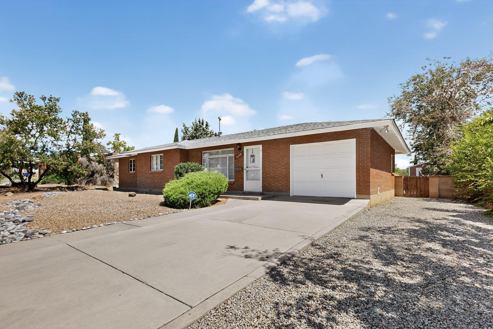 This well-maintained home has been lovingly cared for by the same owner since 1960. Step into a spacious living room that flows into the adjacent dining area and kitchen. The home offers three bedrooms, including a primary suite with a 3/4 bathroom.  The landscaped backyard is perfect for relaxing or entertaining, featuring a covered patio and a large shed.  Upgrades include updated heating and refrigerated air, electrical panel, sewer line with cleanouts (approximately 10 years ago), roof, (approximately 8 years ago) was recently inspected by a licensed roofer, and Pella storm windows.  Located in a convenient NE Heights neighborhood close to shopping, dining, schools and parks. This is a great value!