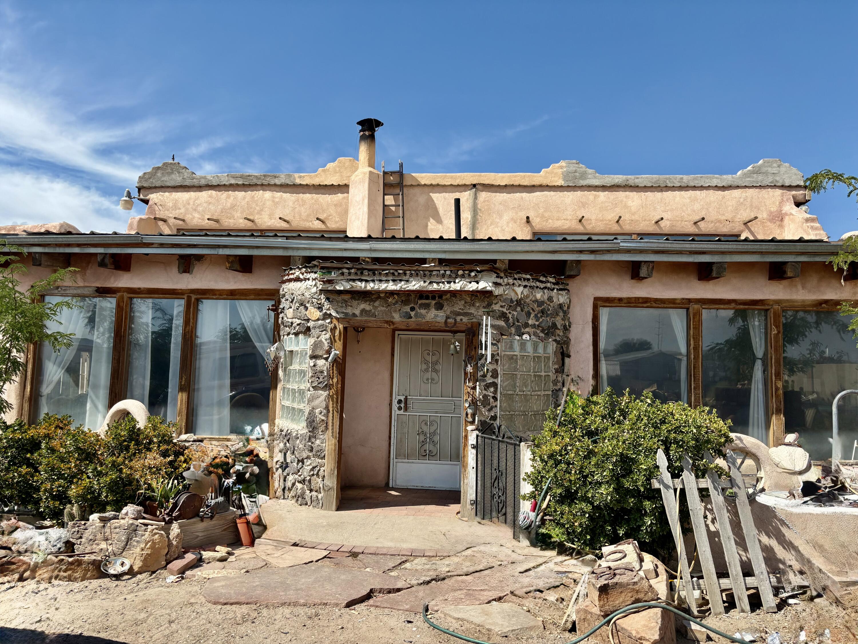 Adobe custom construction and unique old world touches, brick floors, passive solar heating and 3 fireplaces make this a very nice home for the big family.