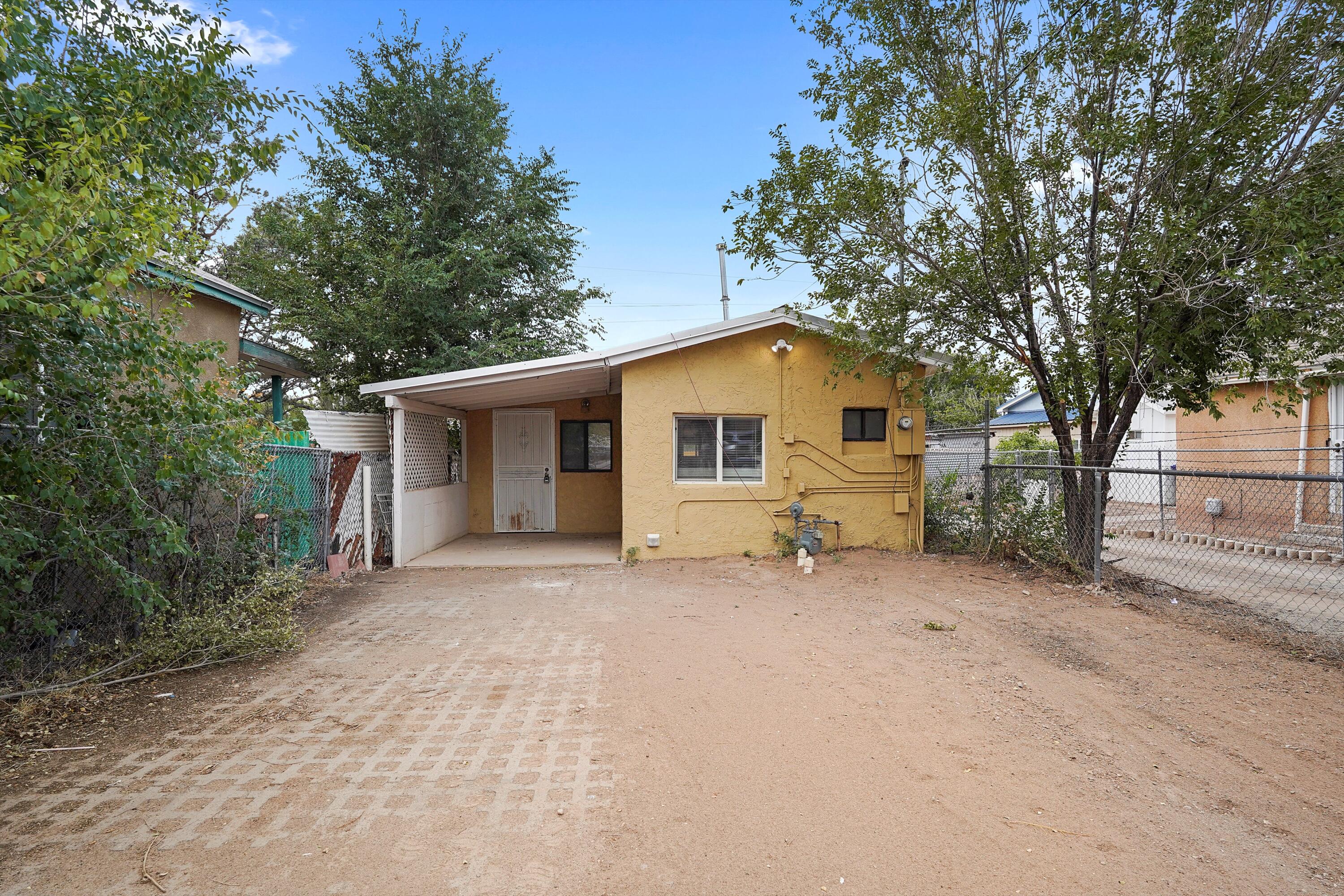 Discover this charming home conveniently located near downtown Albuquerque and with quick access to the freeway, making your commute a breeze. Nestled in a quiet neighborhood, you'll enjoy peace while still being just minutes away from fantastic dining, shopping, and entertainment options. Inside, the home features brand-new flooring throughout, creating a fresh and modern feel. The kitchen boasts stylish finishes that give it a sleek, updated look. Perfect for a first-time homebuyer seeking comfort and convenience!