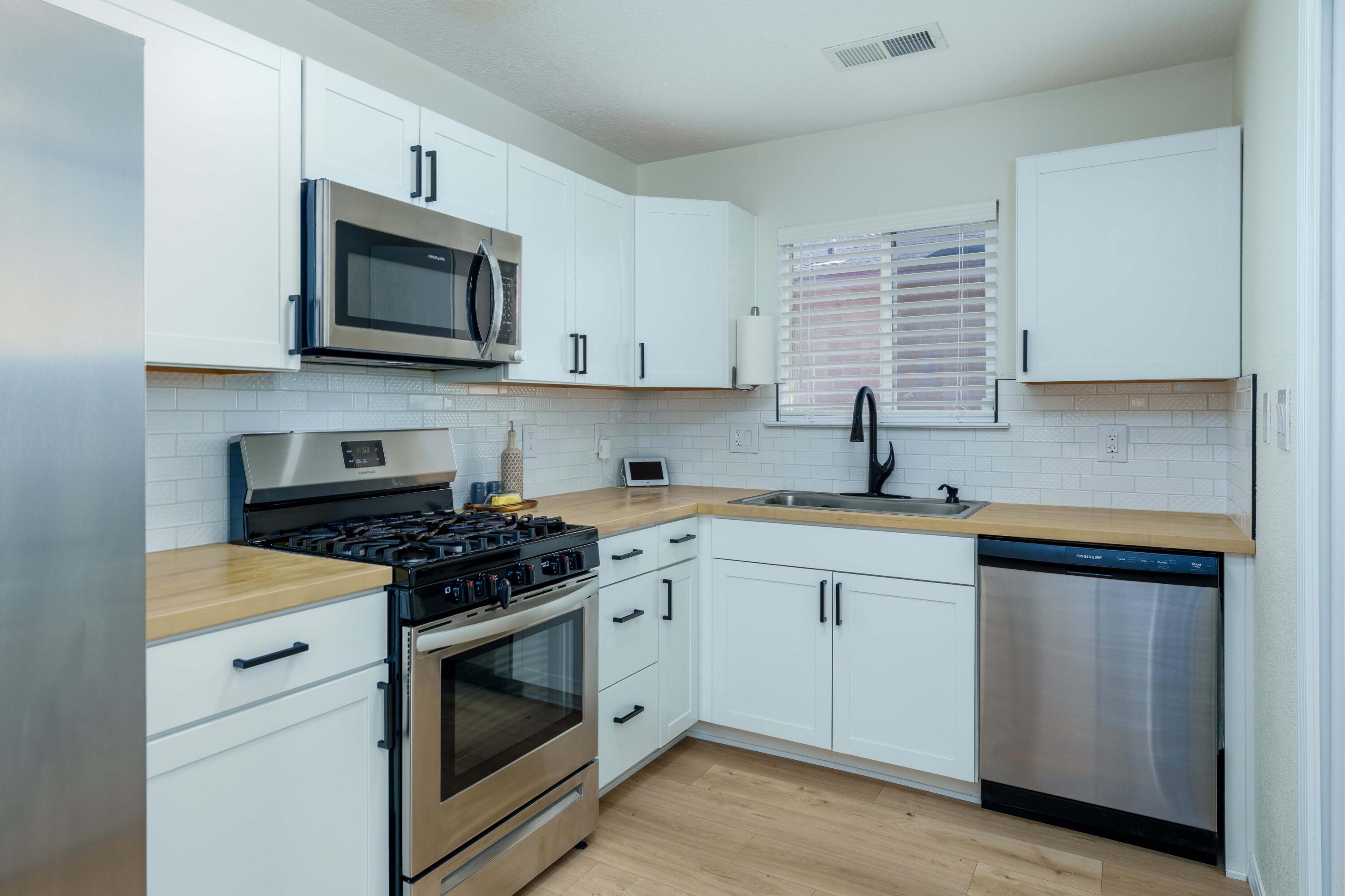 This sweet home in a gated community underwent a complete remodel in 2022 including Pergo Gold flooring throughout, bathrooms, kitchen with stainless steel appliances, light fixtures, & paint. Plus newly upgraded electric and refrigerated air. Enjoy autumn weather in the beautiful backyard with turf and shade!