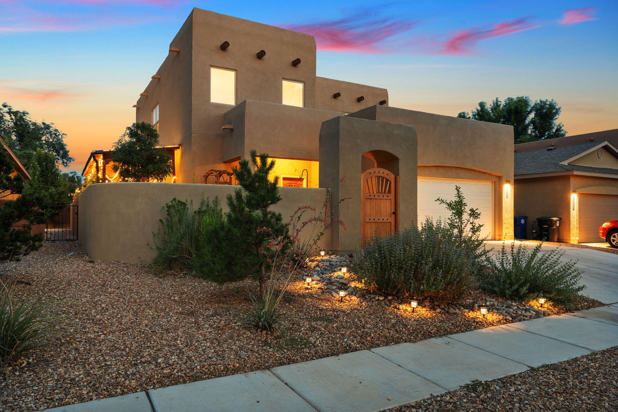Welcome to your next home, where luxury and lifestyle converge. This stunning residence features custom upgrades throughout; a gourmet kitchen w/ granite countertops, a spacious island, a custom backsplash, plus a walk-in pantry w/ glass French doors. Two primary suites each offer spa-like baths w/ soaking tubs, walk-in showers, designer lighting, and custom closets--a perfect retreat for relaxation. Flexible living spaces include dual lounges, a guest suite/office w/ a Murphy bed, custom fit garage, and custom pet-friendly features. The magical resort-inspired backyard showcases a pergola, fire features, outdoor bar, pond, raised gardens, & screened lounge. Your personal sanctuary for buyers who value lifestyle as much as location, minutes ABQ's vibrant Old Town, shopping & Bosque Trails.