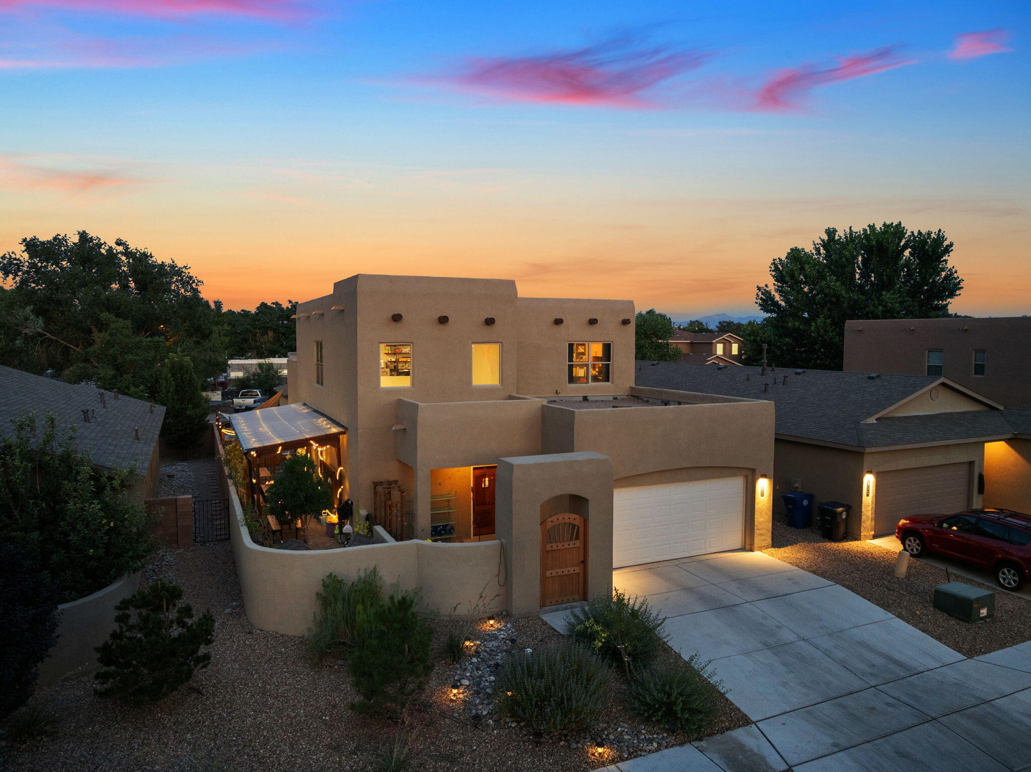 Private Resort Living in a Gated Enclave -- Dual Suites + Swim Spa OasisCustom-upgraded home in a gated community blending luxury and flexibility. Gourmet kitchen with granite, oversized island, custom backsplash, and walk-in pantry w/glass French doors. Two true primary suites feature spa baths with soaking tubs, walk-in showers, designer lighting, and custom closets. Versatile plan with dual lounges, guest/office w/Murphy bed, customized garage, and pet-friendly details. Resort-style yard offers pergola, fire features, outdoor bar, pond, raised gardens,screened lounge and swim spa. Minutes to Old Town, shopping, and Bosque Trails.
