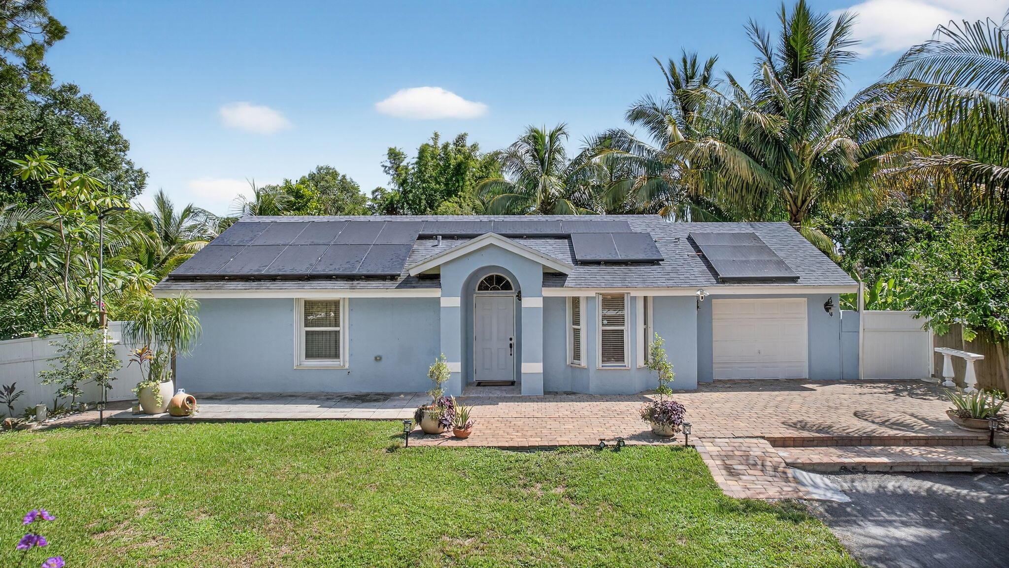 Immaculate 3/2 pool home on 1.59 acres.  Open floor plan, abundant natural light, freshly painted neutral color. Move-in ready, tile floors throughout. Updated kitchen with sleek countertops & brand new kitchen appliances.  Stylish remodeled bathrooms. Relax or entertain in your backyard paradise featuring salt water chorination pool, 2 Tiki bars, lush variety of mature fruit trees including mango, coconut, bananas,guanabana,almond, sugar cane, etc. Peaceful and private lot.New roof 2022, AC 2020, All impact windows, R/O water filtration system 2025, new blacktop driveway.2 RV hookups (sewer, water, electric)