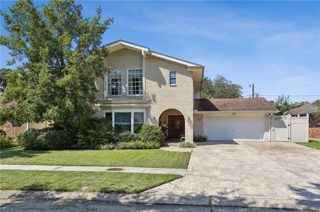 Welcome to 5112 Haring Court, a beautifully renovated brick home in Metairie, just a half block from the lake! Originally renovated in 2007 with Huey Brown custom cabinets, built-ins, and quality materials throughout, then renovated again in 2023, taking out a wall to open up the living room to the kitchen and adding in more cabinet space in the kitchen. This home offers timeless charm with modern convenience. The inviting front exterior features classic bay windows that fill the home with natural light. Inside, the spacious living room boasts recessed lighting and a striking stone gas fireplace, while the dining room includes a pocket door leading to the updated kitchen. A bright sunroom and a laundry area with sink and doggy door add comfort and function. Upstairs, you’ll find carpeted bedrooms for added coziness, with the exception of the Primary suite.
Beautiful finishes and thoughtful updates include Anderson windows and doors, subsurface drainage, and a 16W whole house generator for peace of mind. The backyard is an entertainer’s oasis, complete with an outdoor kitchen, pavilion, lush landscaping , and generous green space. A 2-car garage plus additional driveway parking complete this fantastic, low-maintenance property—perfect for both relaxation and gatherings.