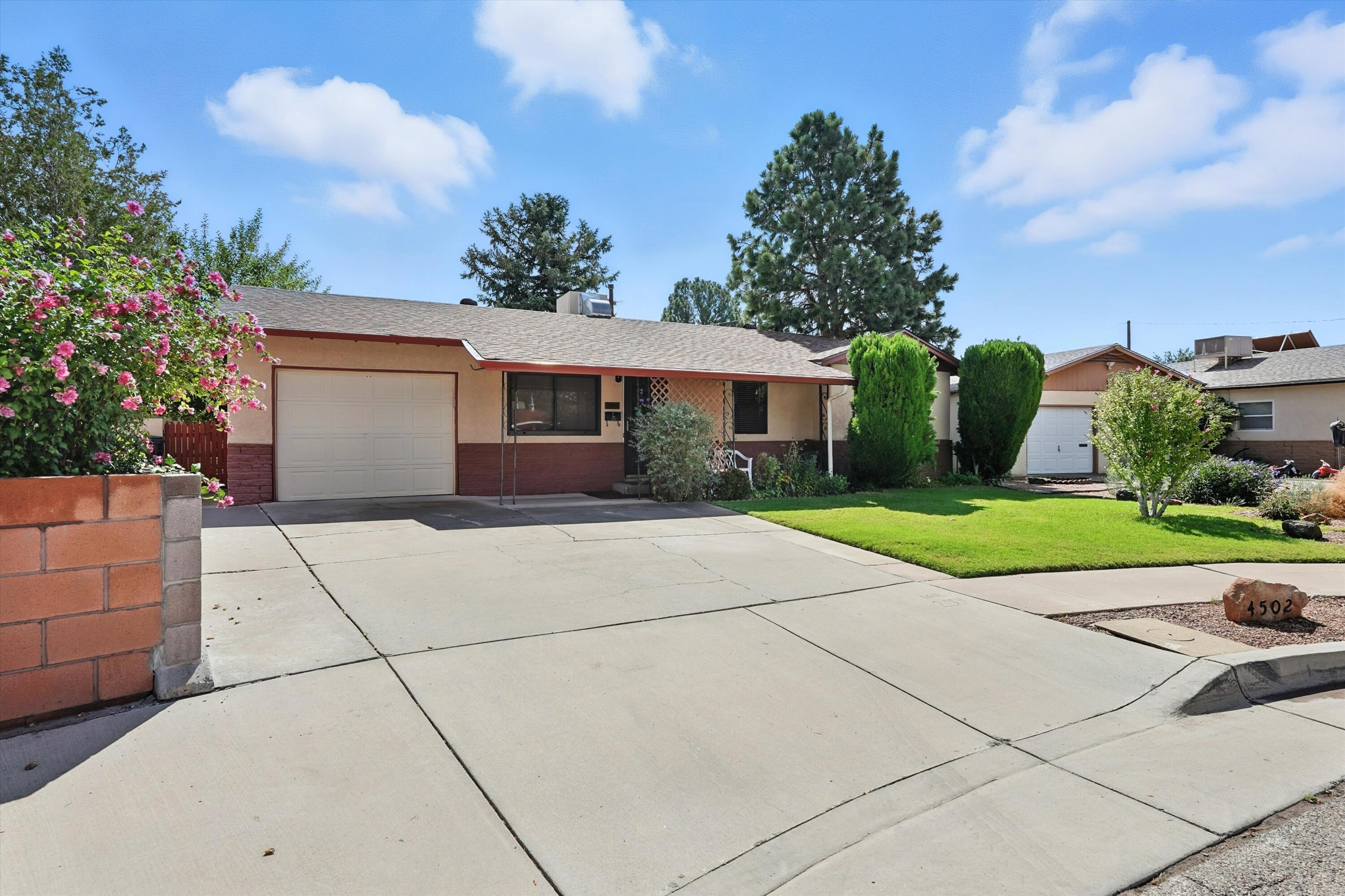 Lovely North Valley three bedroom, two bathroom, located on a quiet cul-de-sac. Featuring a brand new roof/ with leaf guard gutters. Happy and bright sun-room with brick floors, and beautiful open kitchen! Tile and carpet floors throughout. Updated bathrooms with lots of storage a plus. The backyard deck with Gazebo offers the perfect space for fun and easy outdoor entertaining and gardening. Two storage's for additional space needed. This treasure is located close to Griegos Lateral acequia, great for walking the dogs or an evening stroll. Shopping, restaurants, and coffee destinations nearby, as well as the Nature Center, Sawmill District and Indian Pueblo Center. Must see!!