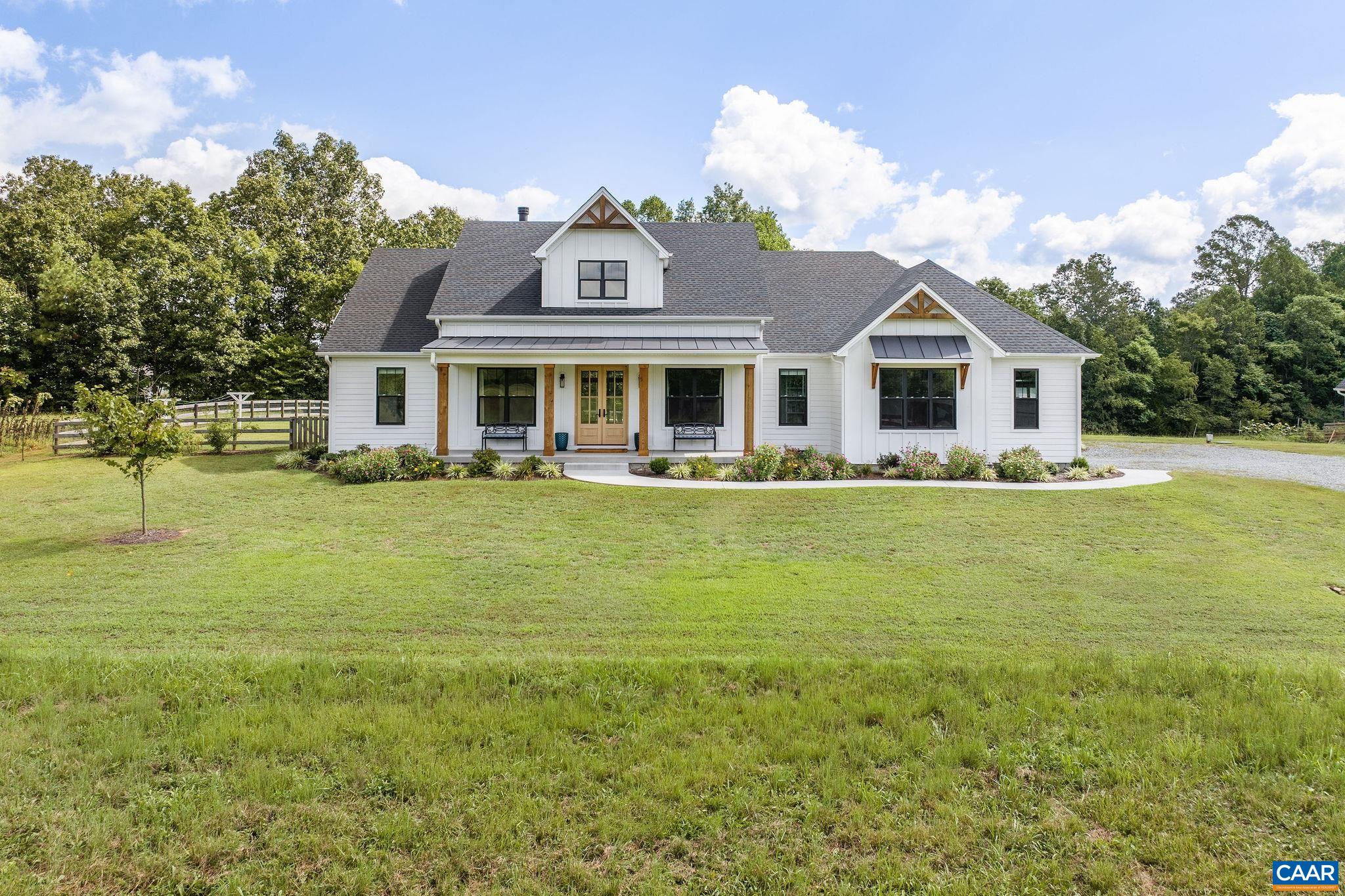 Set among the farms and estates of Scottsville, this 10-acre property offers privacy, thoughtful design, and everyday comfort. The custom-built, all one-level home feels like new, with details that balance craftsmanship and convenience: a wood-burning fireplace with grey fieldstone masonry, 3-panel craftsman doors, and ceramic tile baths including a zero-entry shower with frameless glass enclosure. The kitchen is a standout with upgraded cabinetry, granite countertops, quartz island, tile backsplash, butler’s pantry, and GE appliances. The primary suite features a walk-in closet with granite island. An expansive mudroom with built-in cubbies adds function, while full spray-foam insulation and an energy recovery ventilation system provide efficiency. Outside, the fenced backyard is a private retreat with extensive landscaping, an in-ground pool (heated, for extended seasonal use), and enclosed hot/cold outdoor shower.  Additional detached garage for additional storage or more garage space. Originally designed as a forever home, it’s ready to welcome its next chapter.