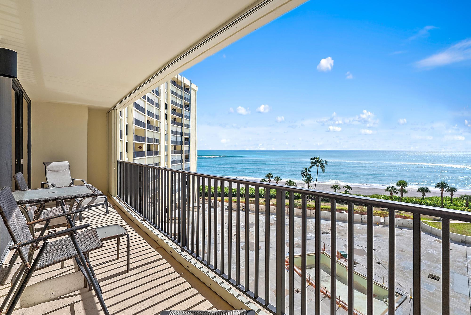 Wake up to breathtaking sunrises and endless ocean views from this 2BR/2BA Ocean Trail condo in the heart of Jupiter. Relax on your private balcony, spend the day on the sandy beach just steps away, or enjoy a peaceful stroll to Dubois Park shaded by coconut palms and seagrape trees. This desirable oceanfront community offers resort-style amenities including direct beach access, a heated oceanfront pool (currently being enhanced), tennis courts, fitness center, social rooms, and 24-hour manned gate security. Inside, enjoy a bright and open living space with floor-to-ceiling windows showcasing the sparkling Atlantic. Ideally located near Jupiter Inlet, the Lighthouse, top-rated dining, boutique shopping, golf, and entertainment. Live like you're on vacation every day.