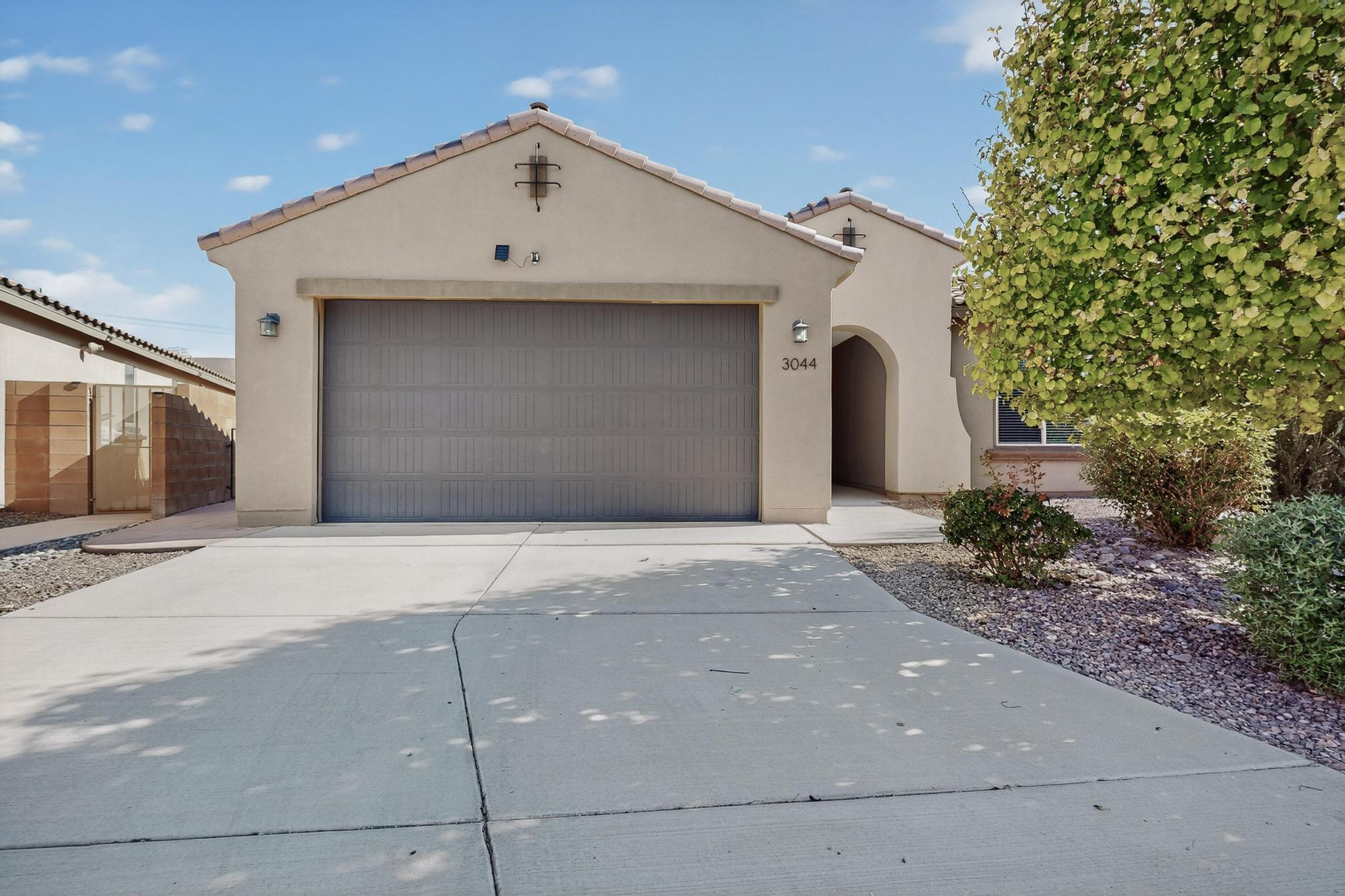 Cabezon community, the Gateway floorplan 3 bedrooms, 2 bathrooms, oversized 2.5 car garage, chef's kitchen, large island, granite countertops, luxurious induction cooktop,   built-in oven/microwave, refrigerator,  pantry, Primary suite showcases a luxurious walk-in shower with tile surrounds. walk-in closets, tankless water heater,  Home sits on over a quarter acre , plenty of outdoor living space,  pergola and fully  landscaped