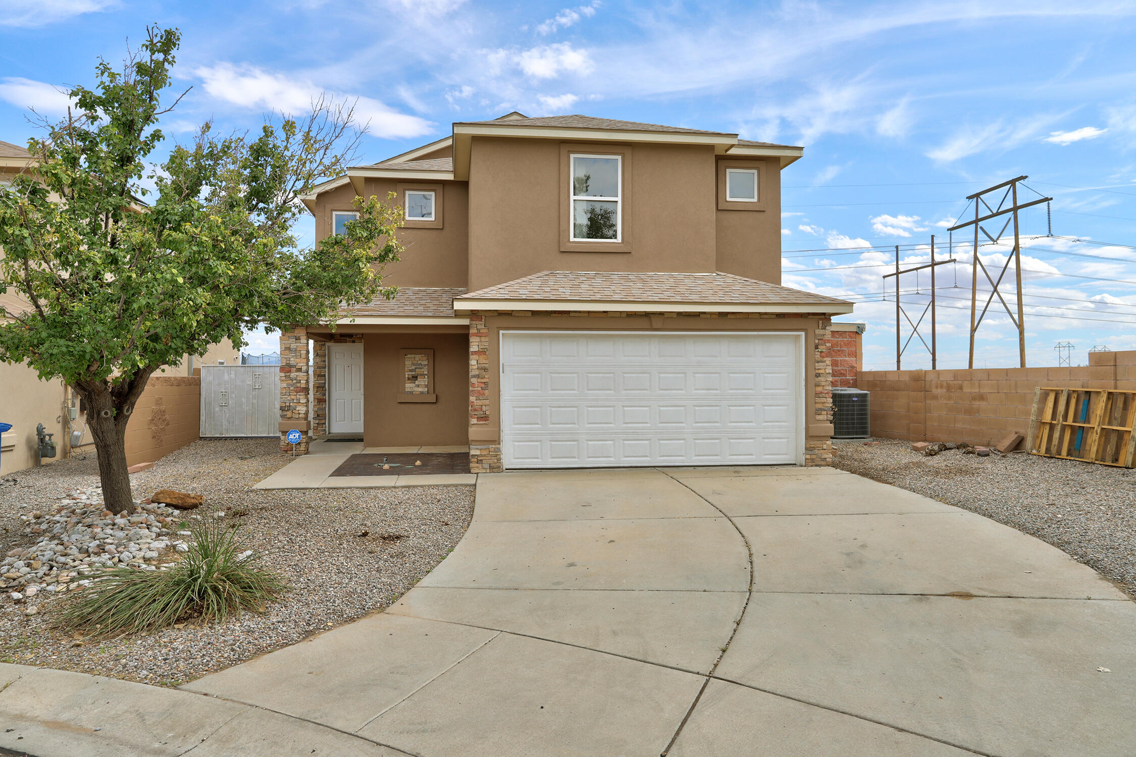 Welcome to this spacious home with mountain views and a fantastic location!  Featuring a newer roof, new stucco and newer refrigerated air!  Comfortable floor plan with two generous living spaces on the main level and one more upstairs provide the perfect canvas for relaxing and entertaining. Primary suite with walk in closet.  No carpet! Beautifully landscaped yard w built in grill.  Location offers quick and easy access to Unser and I- 40.