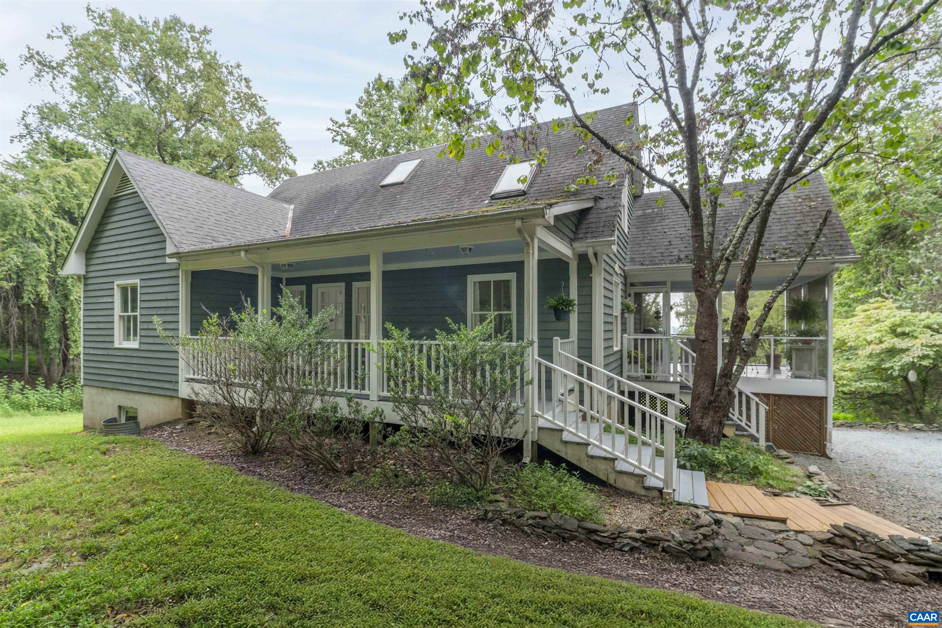 Beautiful mountain views to the east! Architecturally designed and custom-built to take advantage of these views...This light-filled 3/4 bedroom cottage is set on a private 5 acre lot in Emerald Ridge, near Crozet..The bright great-room extends the length of the house. and features a kitchen with a walk-in pantry and opens onto the screened porch...The covered front porch is extended living space as well.. First floor primary suite, features an outdoor shower and a walk-in closet...Full, unfinished, walkout terrace level, with roughed-in bath, offers possibilities for additional living space.