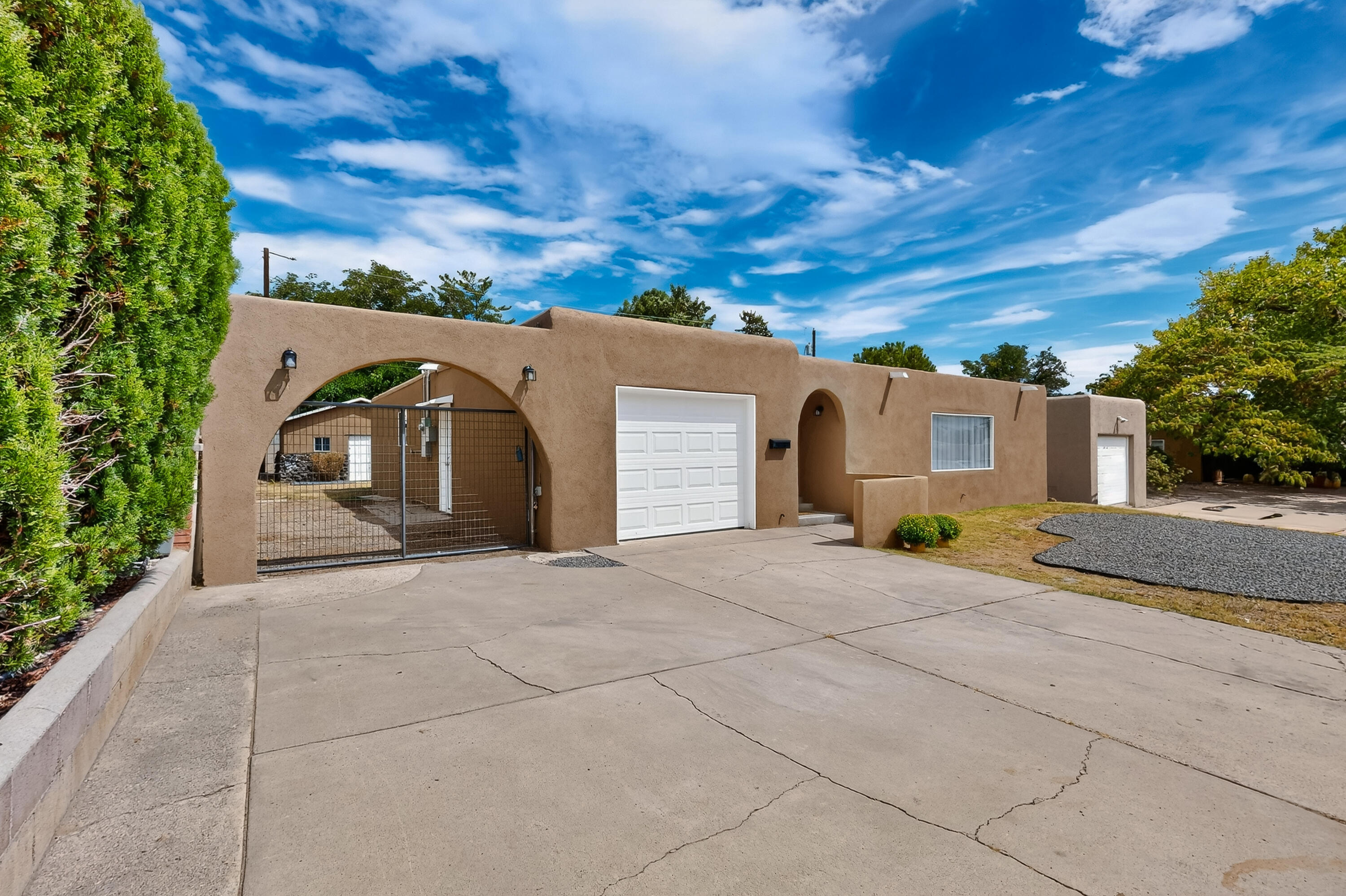 This stunning home has been updated w/ beautiful modern finishes & thoughtful details.  3 bed 2 bath 1 car garage w/ possible back yard access. Recent upgrades include (3/25) roof & windows,(4/25) stucco  (7/25) HVAC combo w/refrigerated air, & water heater. (5/25) upgraded electrical service panel. Step inside to an open, inviting layout featuring a gorgeous modern kitchen. A chiefs dream featuring new cabinets, quartz counter tops, stainless steel appliances & recessed lighting. Both bathrooms have been beautifully refreshed (5/25) w/ vanities, countertops, updated lighting, stylish shower backsplash/shower heads.  The living room has a  sleek electric fireplace. The backyard offers plenty of space for entertaining, along w/storage shed. With fresh updates & move in ready condition