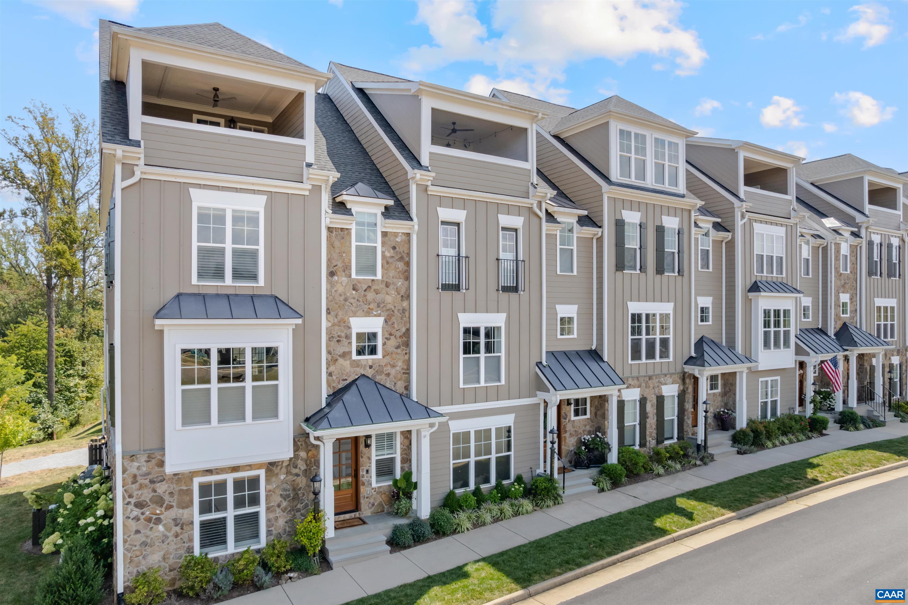 Luxury ELEVATOR townhome in Old Trail in Crozet. Exceptionally appointed and meticulously maintained. Low maintenance exterior and landscaping care included in HOA. Additional width enhances all of the spaces on each floor, especially the garage and main living area. The main level offer mud room, bedroom/office with full bath. The main level is perfect for entertaining with spacious kitchen open to living and dining. The coffered ceilings, upgrading lighting, tile backsplash, built ins, large island, stainless appliances, and luxury vinyl plank flooring set the elegance of these spaces. Enjoy easily accessed outdoor living through double french doors to the spacious screened porch. The next level up features a great primary suite with tray ceiling, large windows, dual closets and spa-like bathroom including heated floors, walk in shower, and double vanities. Two additional bedrooms, full bath and laundry on this level. The top level features a 2nd kitchen and spaces perfect for separate living quarters, home office, or any other purpose you may need. Enjoy the screened rooftop veranda with mountain views as additional outdoor living space. Additional features include energy efficient construction and a conditioned garage.