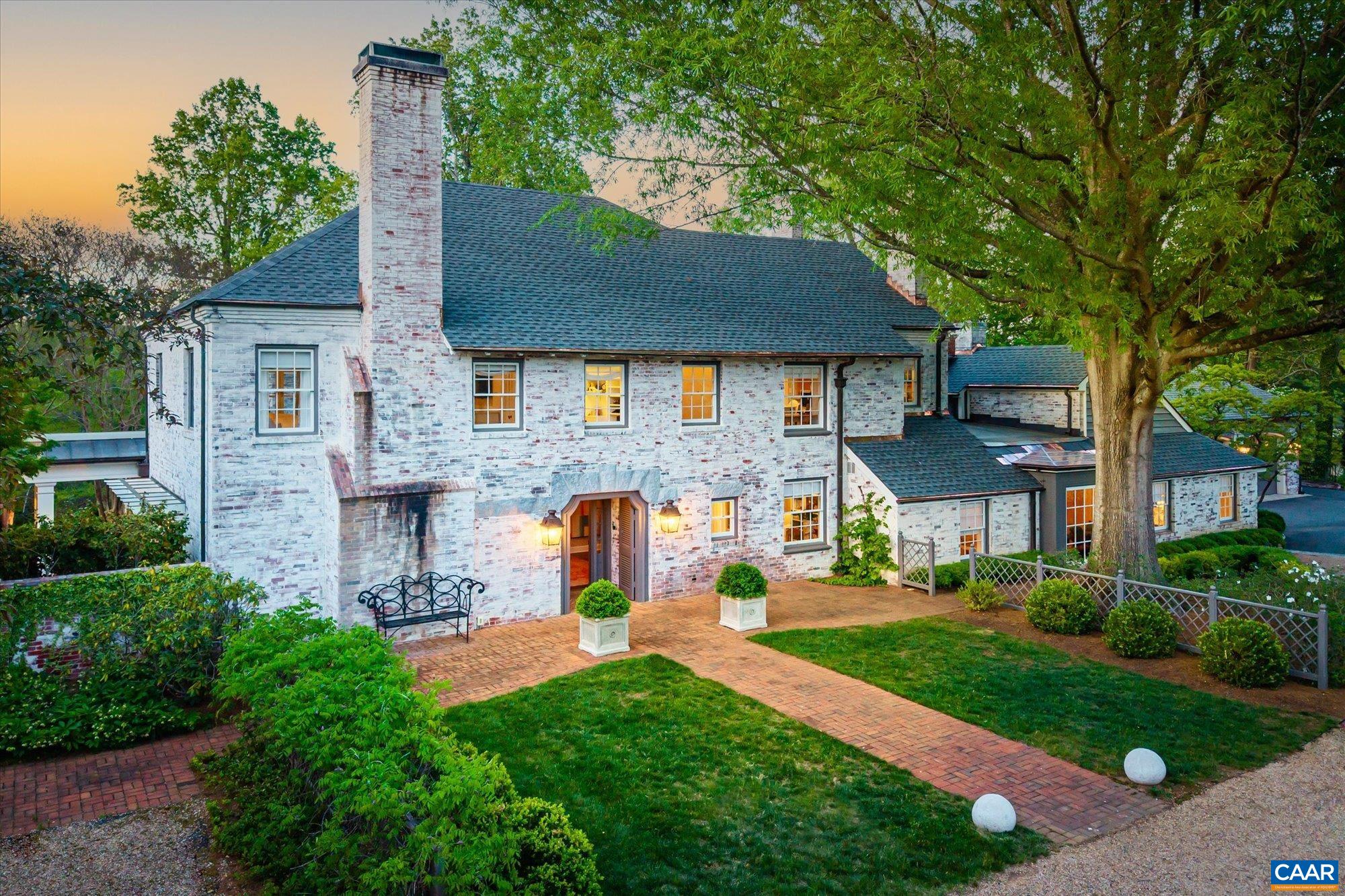 Tucked at the end of a private drive and adjacent to Farmington’s golf course, this exceptional six-bedroom estate offers a rare opportunity in one of the Mid-Atlantic’s most coveted neighborhoods. Completely reimagined and expanded in 2018, the home is turn-key and impeccably appointed, featuring a professionally curated interior, a seamless blend of expansive and intimate living spaces, a dream kitchen with Calacatta Gold countertops, custom millwork, an elevator, and en-suite bedrooms on every level. Outdoors, relax or formally entertain on the covered patio, enjoy the charming pool, and take in the thoughtfully lit, meticulously landscaped grounds—all offering surprising seclusion. A two-bay garage with a dedicated golf cart bay, whole-house generator, and refined finishes throughout complete this remarkable offering. Just a stone’s throw from nationally ranked Farmington Country Club, this residence effortlessly combines luxury, serenity, and sophistication.