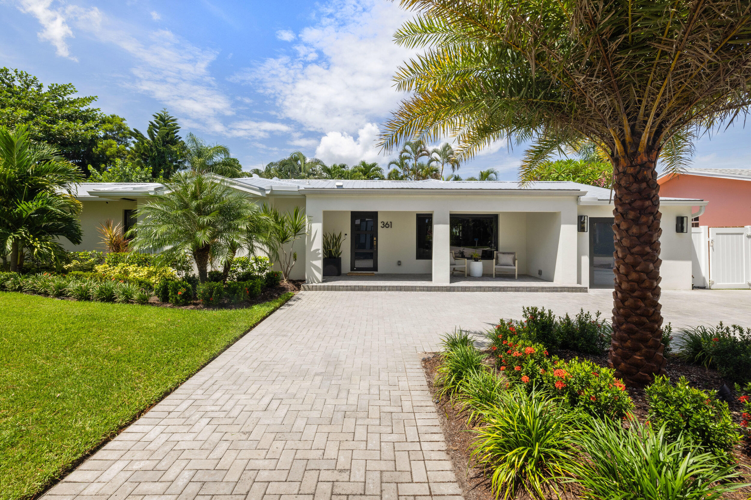 Live just steps from the ocean in this fully reimagined 3-bedroom, 3-bath luxury home located in the heart of Juno Beach. With no HOA, you have the freedom to enjoy true beachside living without restrictions.Every inch of this home has been thoughtfully redesigned with high-end finishes and a relaxed, modern coastal feel. Inside, you'll find gorgeous engineered wood floors throughout, adding warmth and elegance to the open-concept layout. The spacious living and dining areas flow effortlessly toward the backyard, where a sparkling custom pool awaits complete with lush turf surround and a stunning waterfall feature that creates a tranquil, spa-like ambiance.
The gourmet kitchen features top-of-the-line, fully stainless steel appliances, sleek countertops, and custom cabinetry, plus a butler's pantry offering extra storage and prep space ideal for entertaining.
Each of the three bedrooms offers its own spa-inspired bathroom, with designer touches and thoughtful details throughout. Step outside to your private rooftop lounge, perfect for soaking in the sun or enjoying ocean breezes under the stars.
Major upgrades include a new roof, new a/c, and new water heater, providing both luxury and peace of mind.
This rare gem combines style, comfort, and location in one of Florida's most desirable beachside communities with no HOA to limit your lifestyle.
