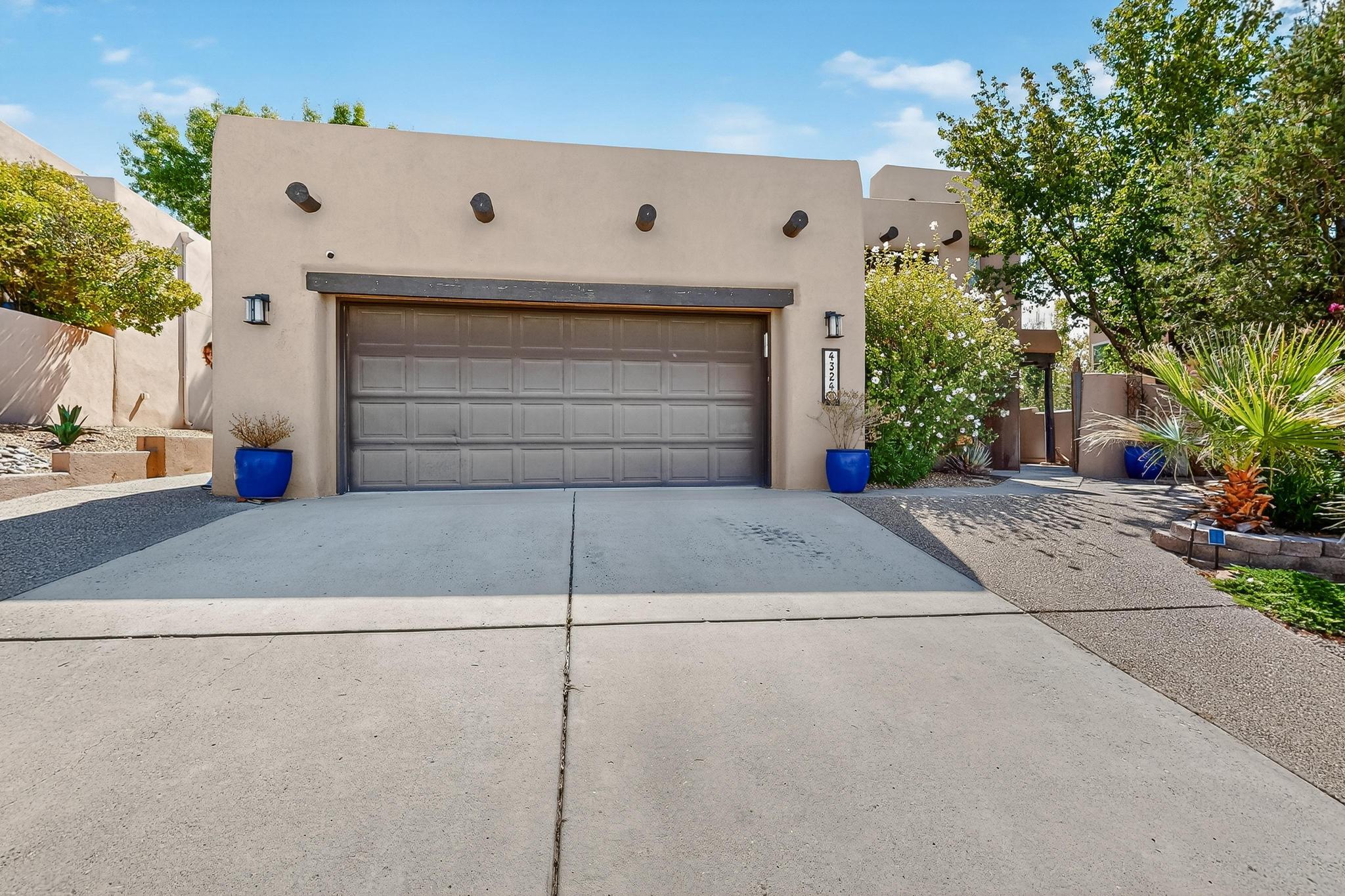 Enter this Gorgeous Home through a welcoming courtyard into a grand foyer. The kitchen has been remodeled with a deep sink, an exquisite backsplash, beautiful counter tops a & pantry with a kitchen nook, & an island bar around the induction cooktop! It's perfect for entertaining with the kitchen open to the family room with soaring ceilings & a fireplace, next to a covered patio with a beautifully landscaped yard. Still More: a formal dining room, a living room, & an oversized garage. The master suite has 2 walkin closets & is on the 1st floor. The upstairs has 2 wings, one with a 2nd master suite & the other side with 2 bedrooms & a Jack and Jill bathroom. The large loft walks out to a balcony & can be converted into a 5th bedroom or study. Convenience is key to this home's  location!