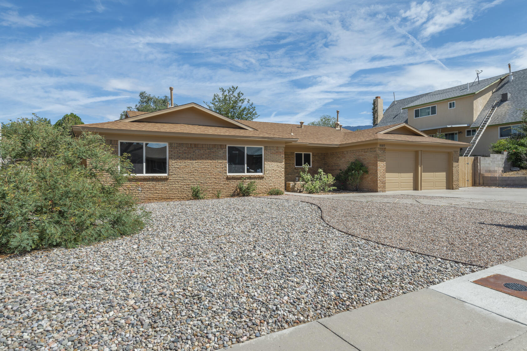 You'll be impressed with the attention to detail and quality finishes in this lovely Far NE Heights ranch home.  Enjoy clean, modern finishes, including smooth-textured walls, hardwood trim, solid panel doors w/ new hardware, 12'' x 24'' tile, and beautiful LVT flooring. The kitchen features solid panel cabinetry, granite countertops, and high-end appliances. The main ensuite boasts floating cabinetry and stylish fixtures. New lighting and plumbing fixtures throughout. Upgraded electrical and new refrigerated air!  Step outside to a spacious 29'x12' covered patio--where the backyard is ready for the new owners' inspirational design--conveniently located in the desirable far NE heights near shopping, top restaurants, and public transit. Come take a look to appreciate this exceptional value!