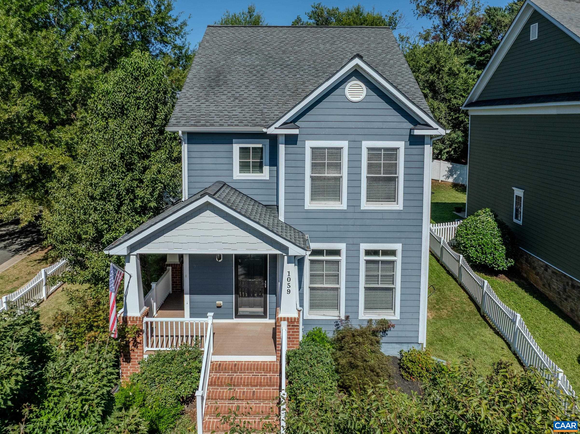 Charming, Old Trail craftsman style home that is walkable to downtown Crozet! Bright, open floor plan with high ceilings, fresh paint, and gorgeous hardwood floors. Open main level features a large living room with gas fireplace surrounded by custom built-ins. Gourmet kitchen is a home chef’s dream, with expansive granite surfaces, ample white cabinetry, reverse osmosis water filter, built-in beverage cooler, tile backsplash and breakfast bar. The dining area is just perfect, natural light pours in from 2 sides, including the french doors that lead to the screened porch.  Completely updated screened porch with string lighting overlooks large paver patio with built-in firepit, and fenced yard with off-street parking. Upstairs you will find a spacious master suite with multiple closets, including a walk-in, and a well-appointed master bath with frameless glass shower. 2 additional bedrooms and a full bath complete the upper level. Conditioned crawl space, storage shed, and floored attic provide extra storage.